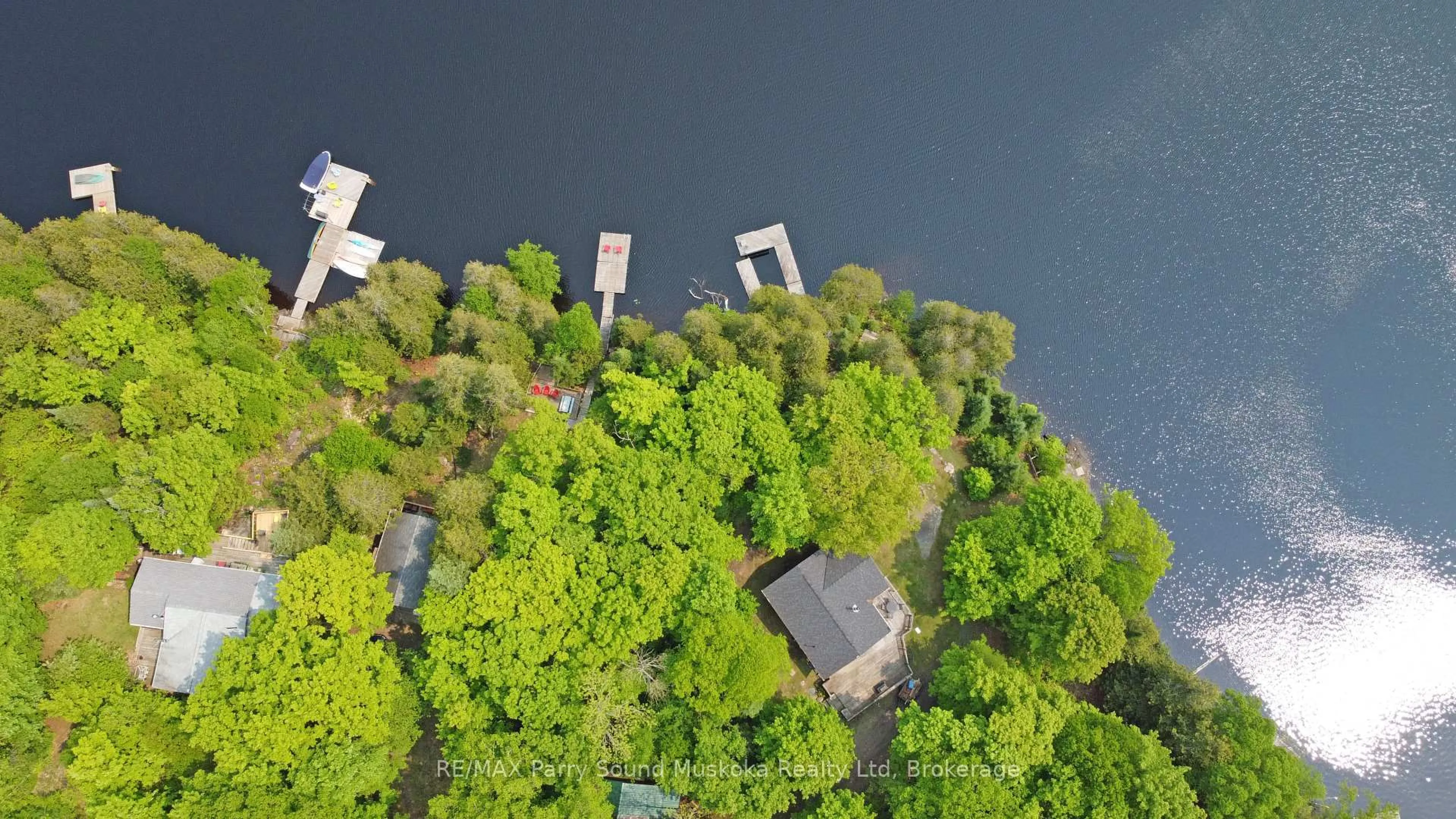 A pic from outside/outdoor area/front of a property/back of a property/a pic from drone, water/lake/river/ocean view for 84 Captain Estates Rd, Whitestone Ontario P0A 1G0