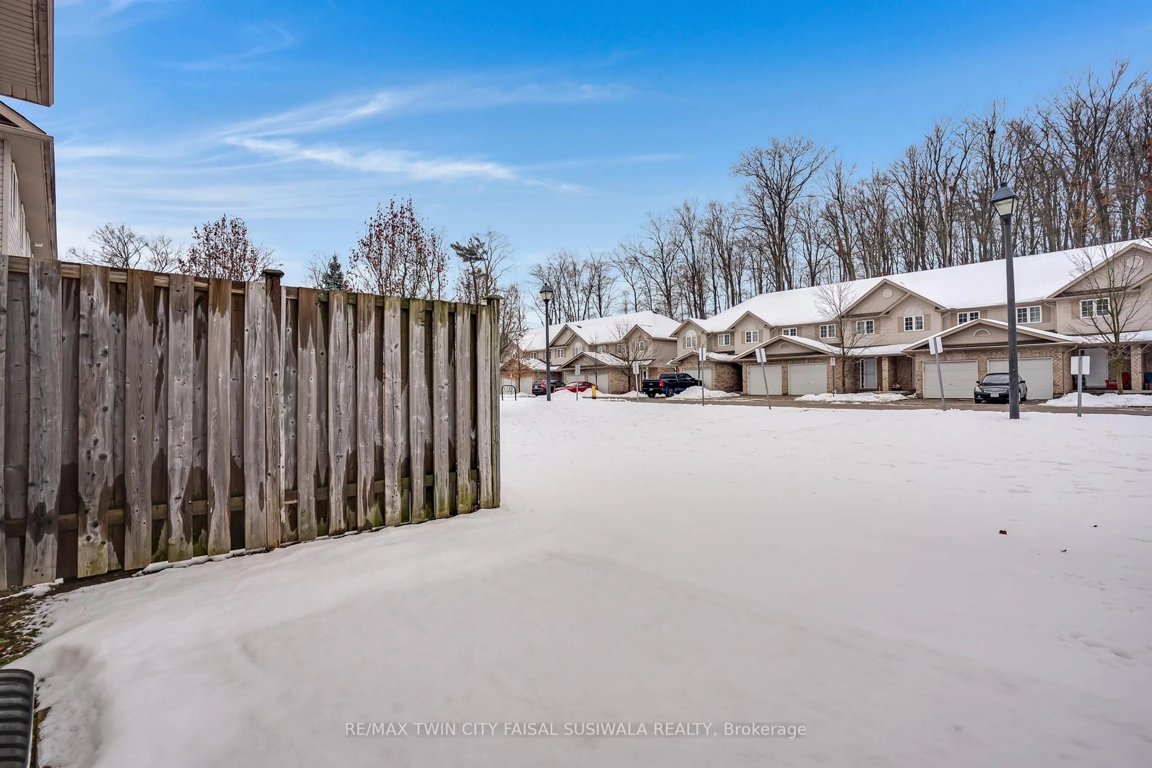 A pic from outside/outdoor area/front of a property/back of a property/a pic from drone, street for 310 FALLOWFIELD Dr, Kitchener Ontario N2C 0A9