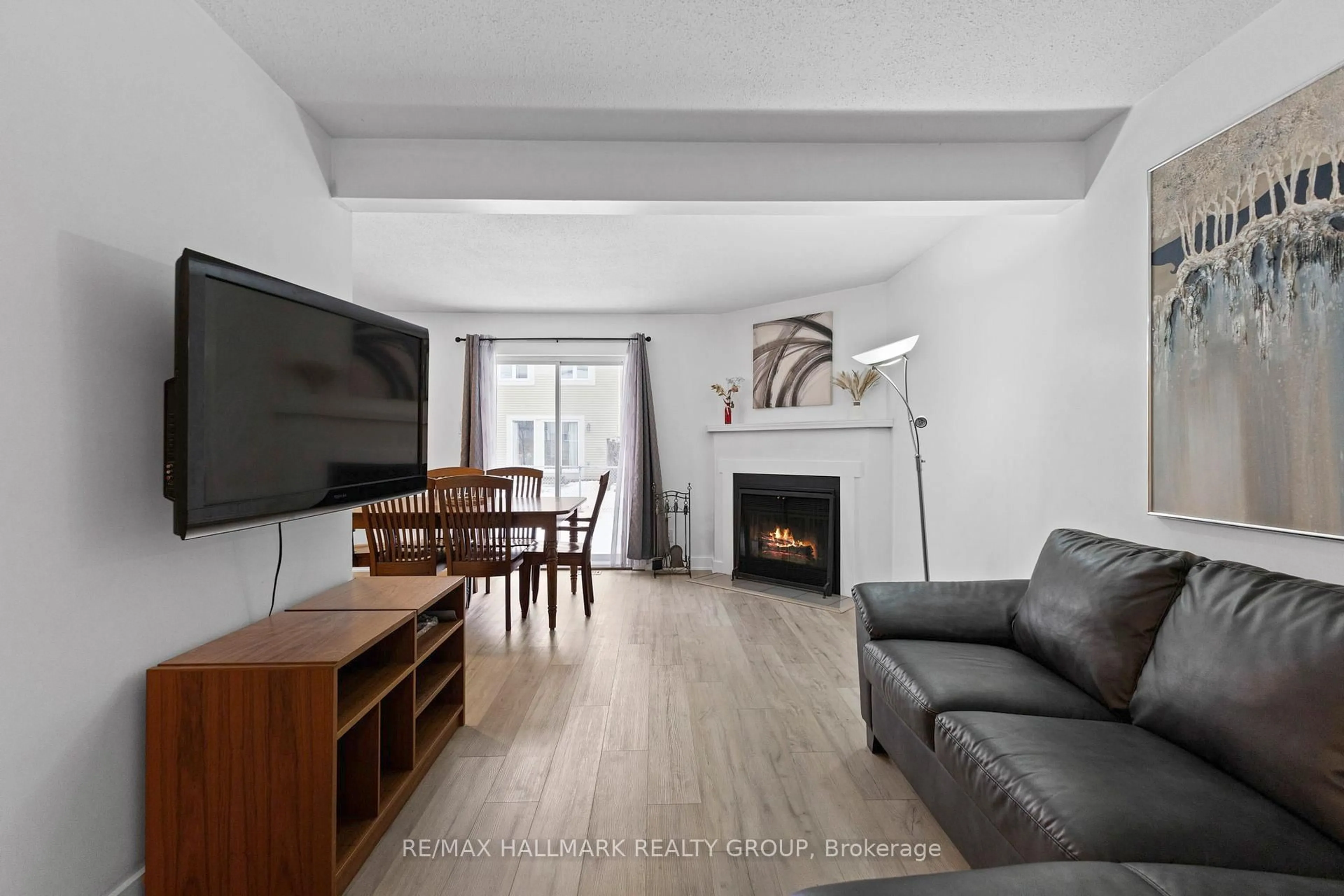 Living room with furniture, wood/laminate floor for 463 Canotia Pl, Ottawa Ontario K4A 2K2