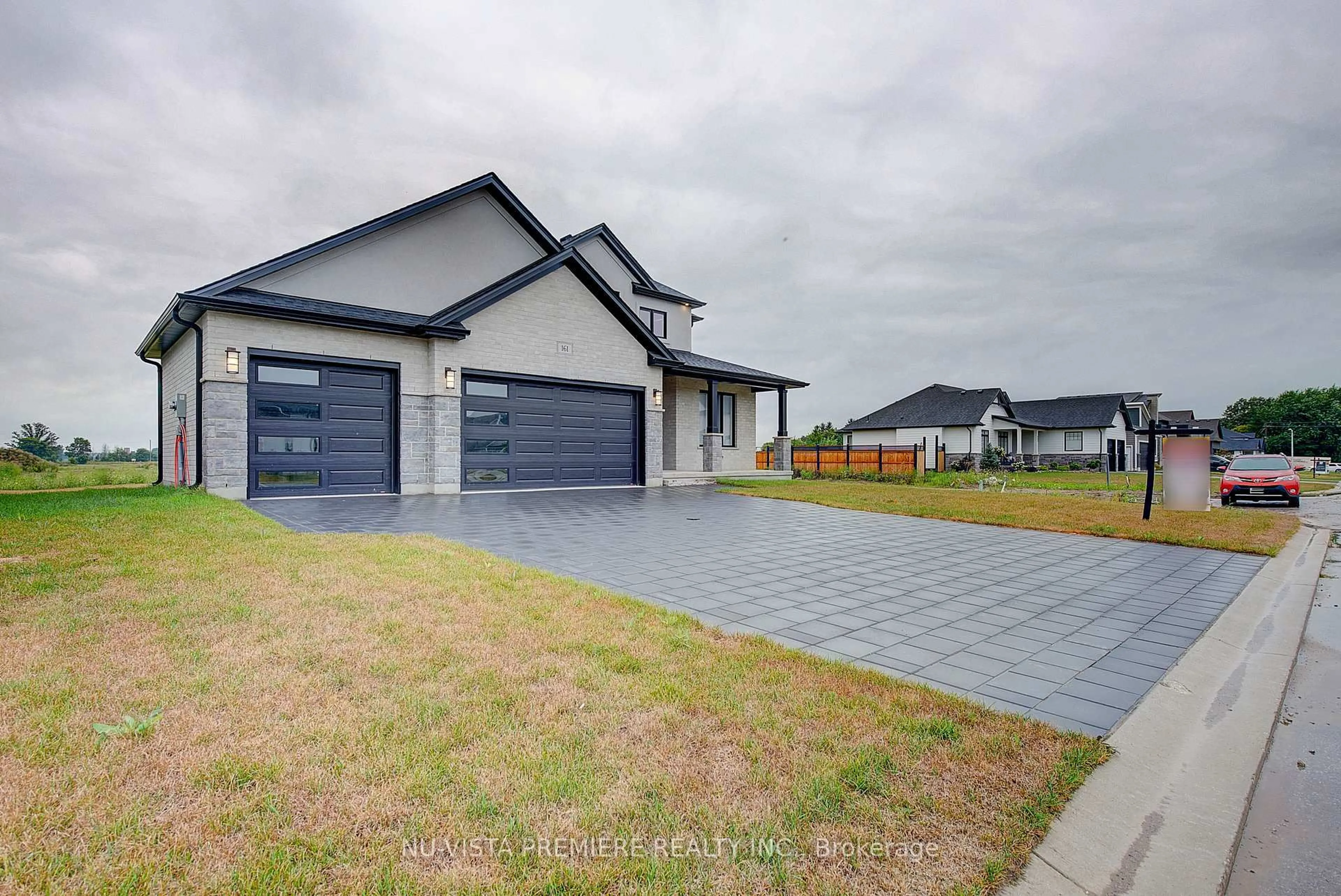 A pic from outside/outdoor area/front of a property/back of a property/a pic from drone, street for 161 Mcleod St, North Middlesex Ontario N0M 2K0