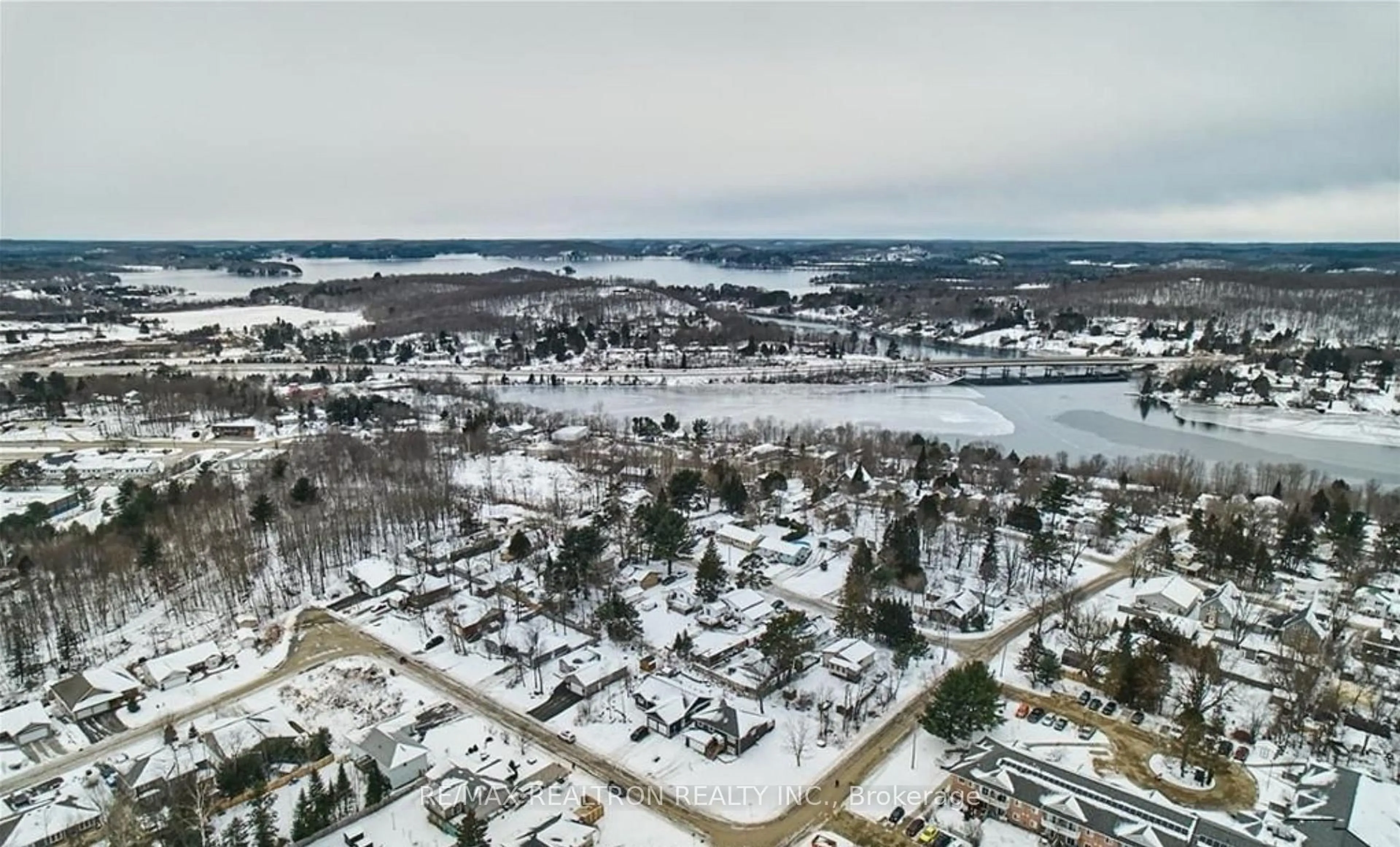 A pic from outside/outdoor area/front of a property/back of a property/a pic from drone, water/lake/river/ocean view for 1 Northdown St, Huntsville Ontario P1H 2R3