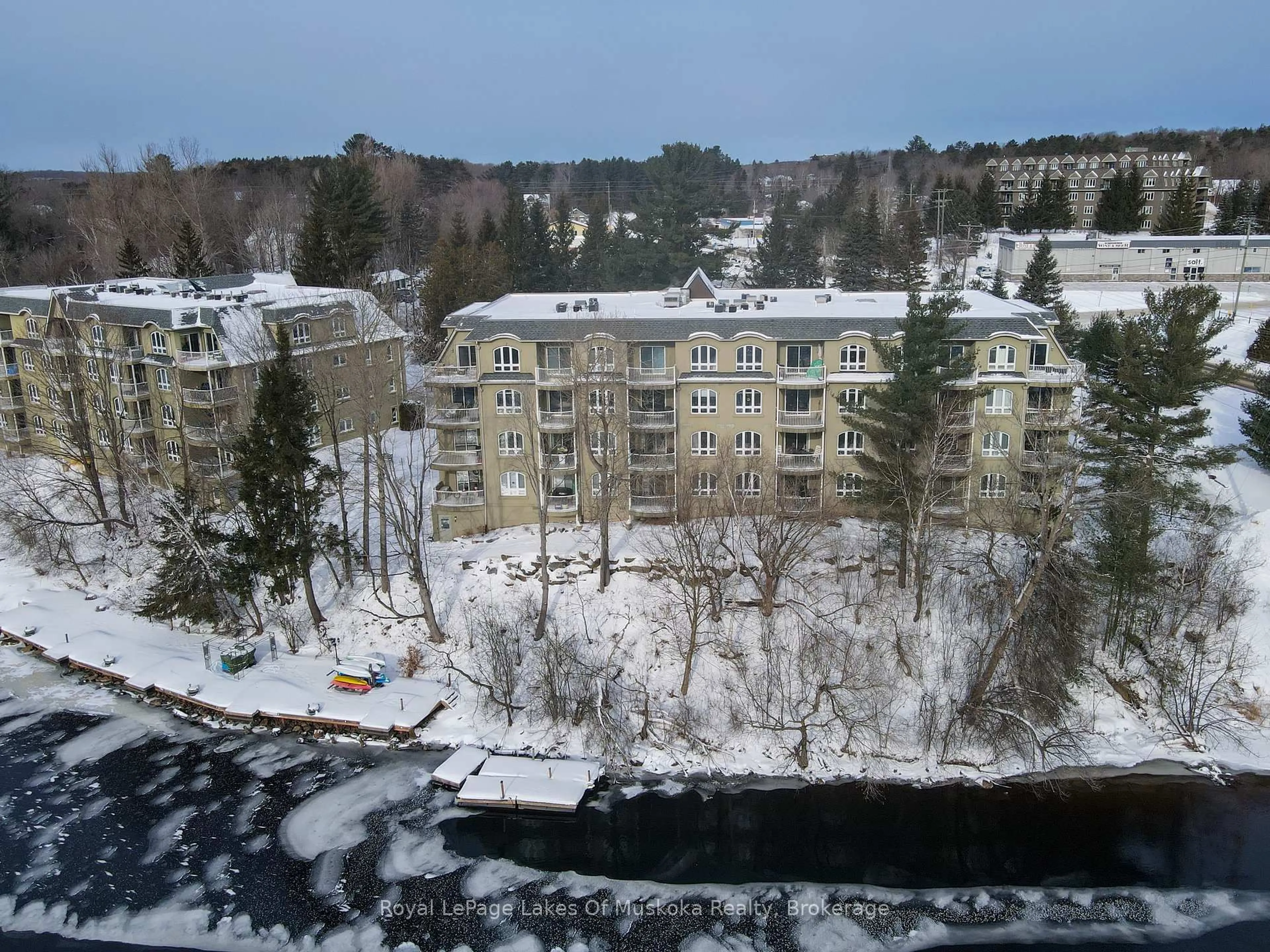 A pic from outside/outdoor area/front of a property/back of a property/a pic from drone, water/lake/river/ocean view for 31 Dairy Lane #106, Huntsville Ontario P1H 2L7