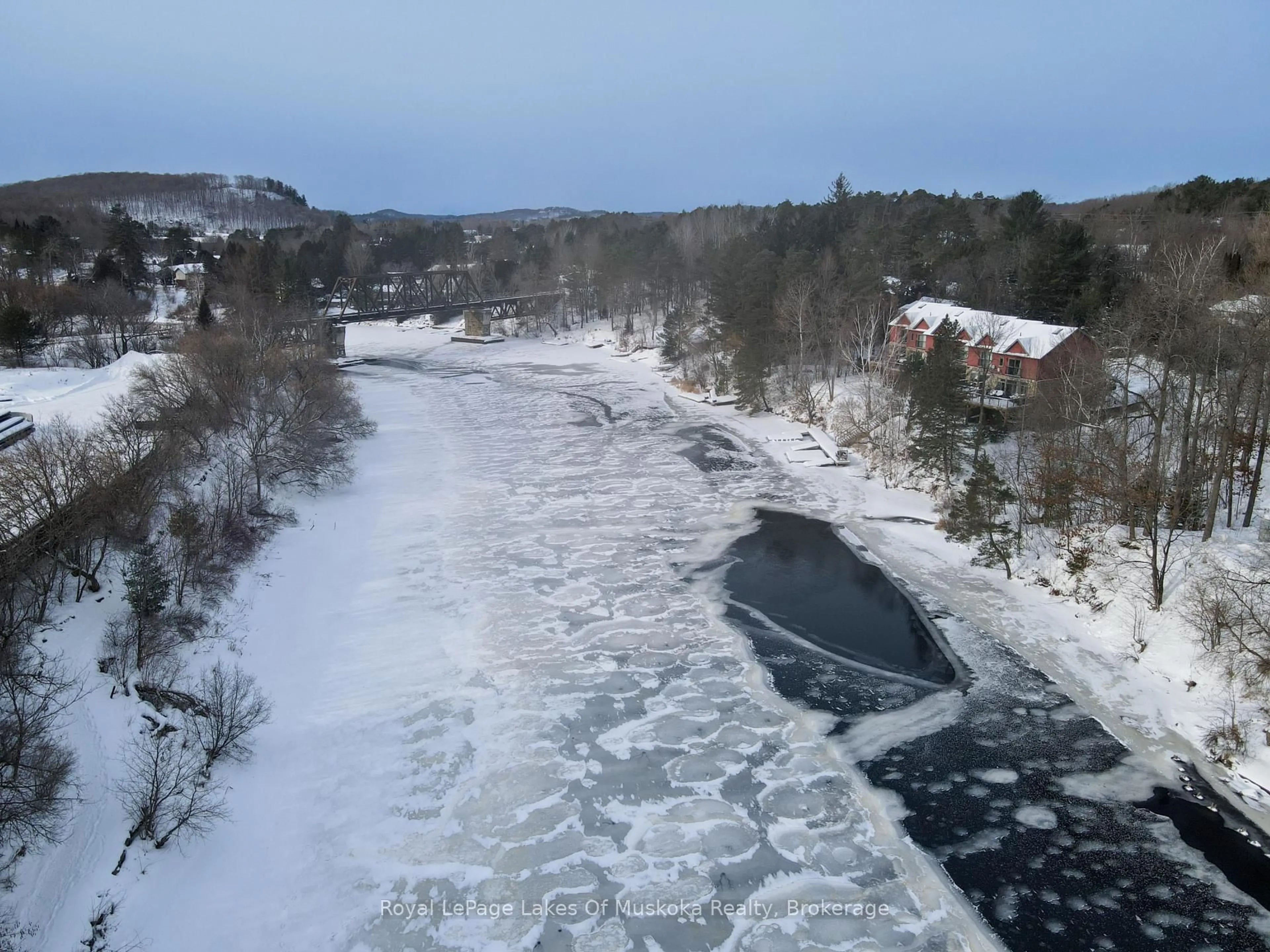 A pic from outside/outdoor area/front of a property/back of a property/a pic from drone, street for 31 Dairy Lane #106, Huntsville Ontario P1H 2L7