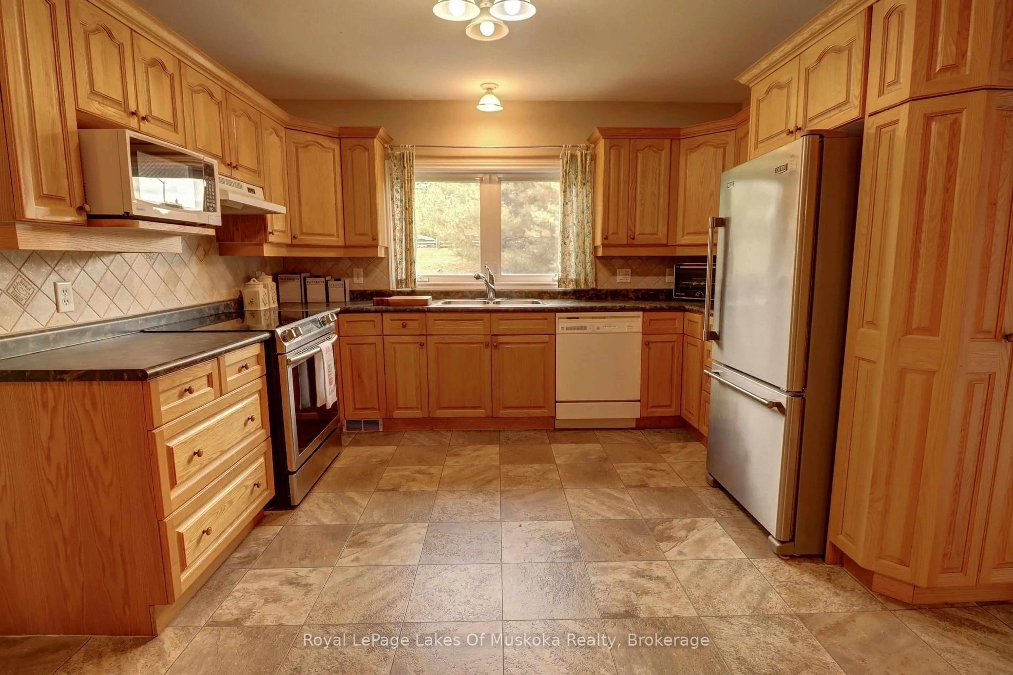 Standard kitchen, ceramic/tile floor for 31 Dairy Lane #106, Huntsville Ontario P1H 2L7