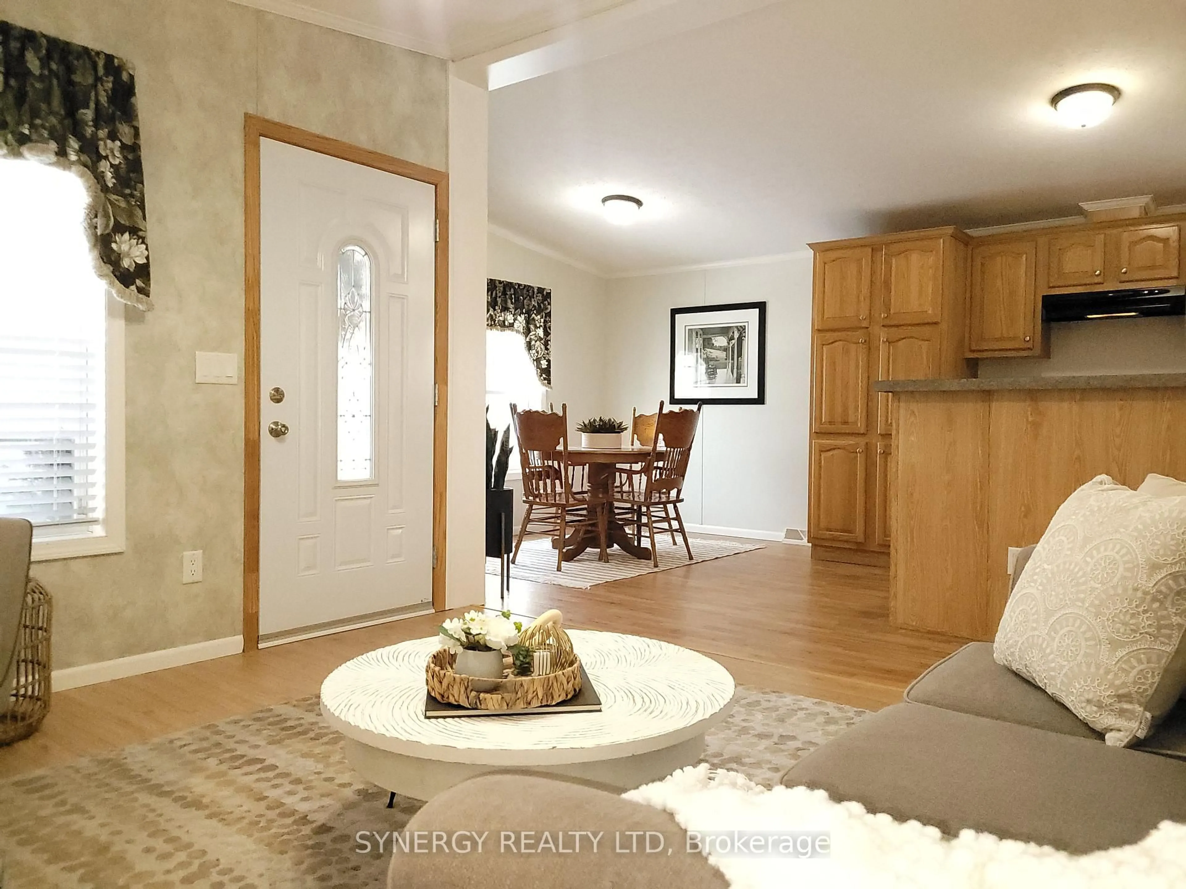 Living room with furniture, wood/laminate floor for 461 Richard Cres, Strathroy-Caradoc Ontario N7G 0C5