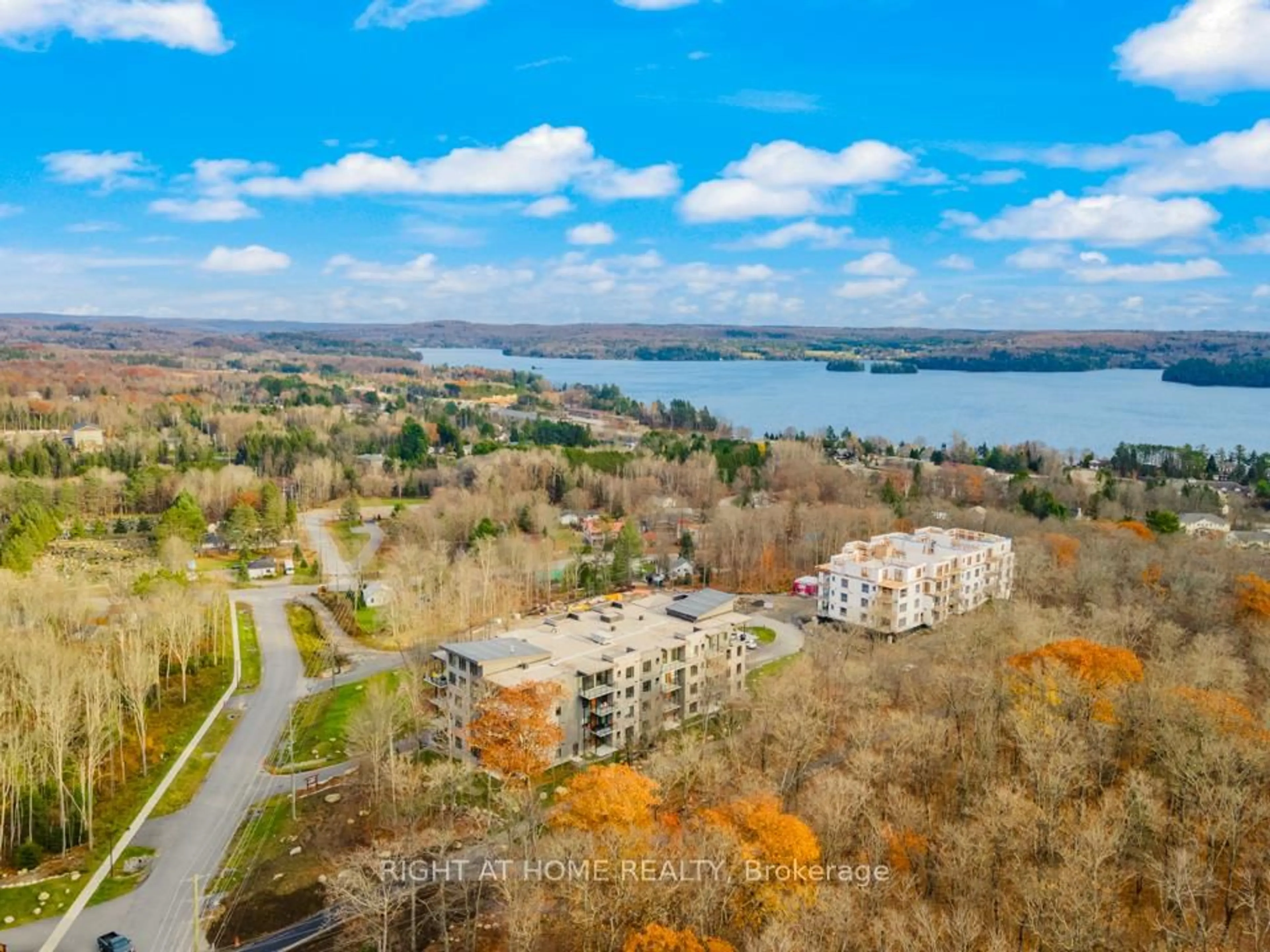 A pic from outside/outdoor area/front of a property/back of a property/a pic from drone, water/lake/river/ocean view for 18 Campus Tr #107, Huntsville Ontario P1H 1C6