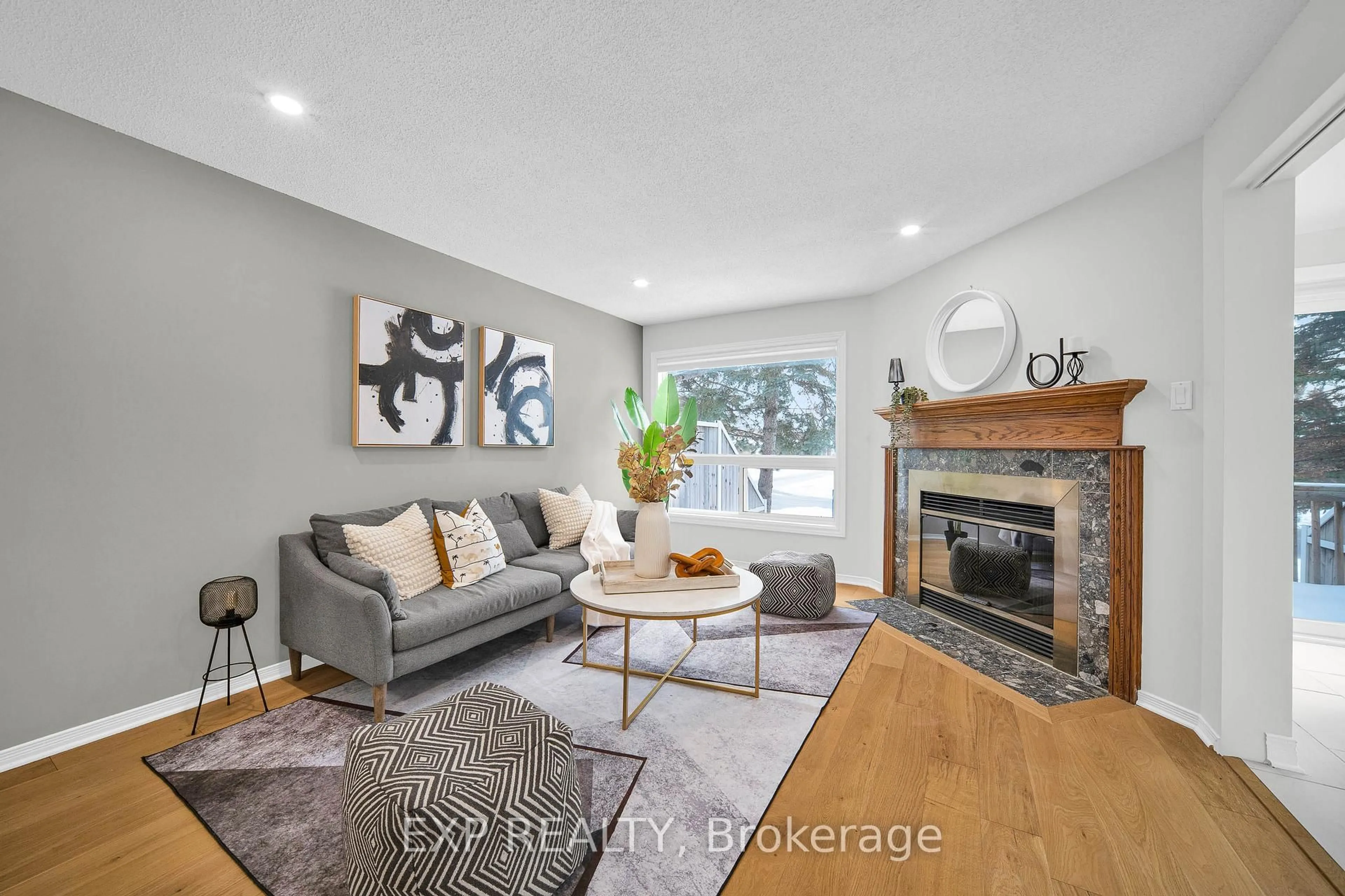 Living room with furniture, wood/laminate floor for 14 Sandcliffe Terr, Ottawa Ontario K2G 5X1