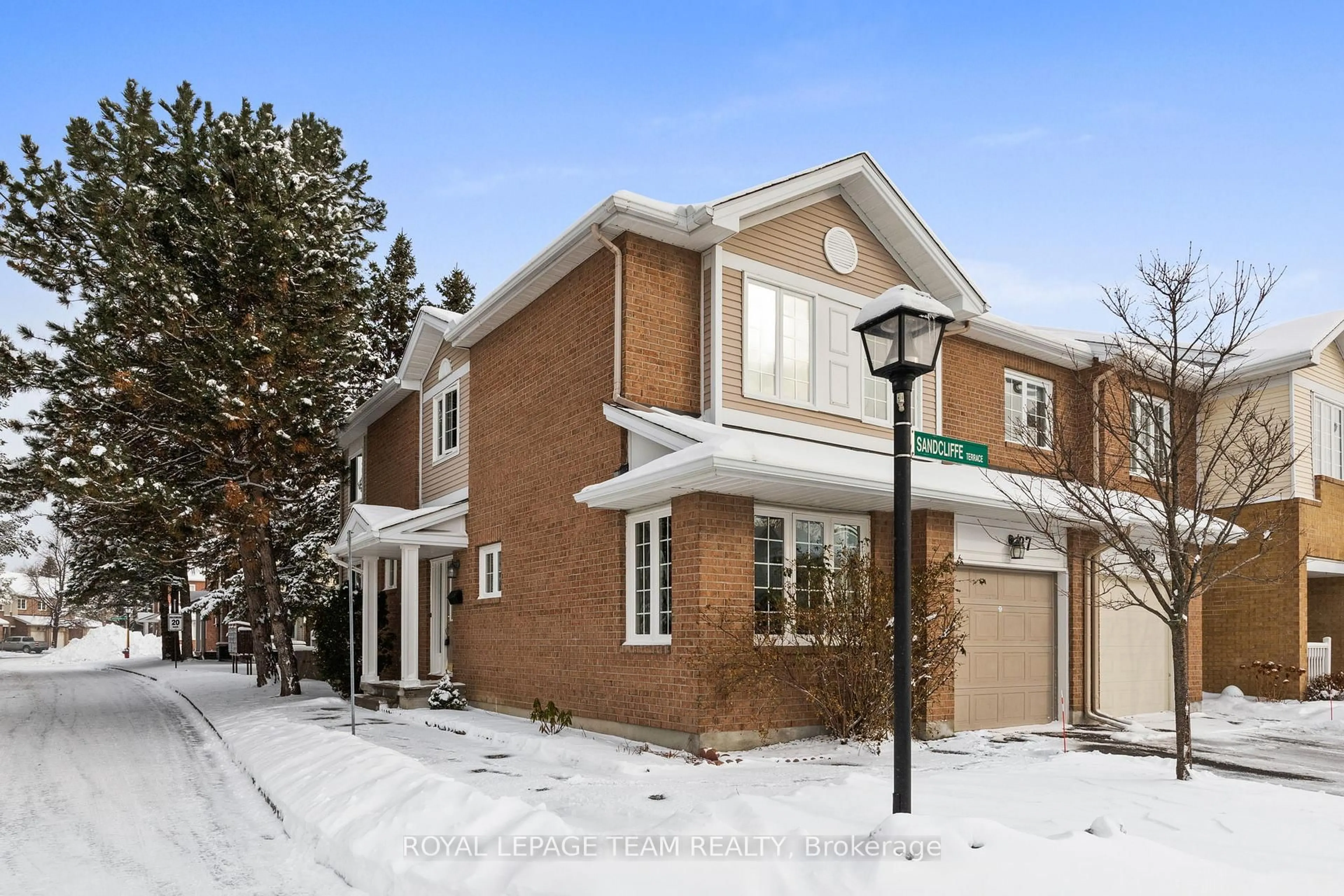 Home with brick exterior material, street for 27 Sandcliffe Terr #8, Ottawa Ontario K2G 5Y2