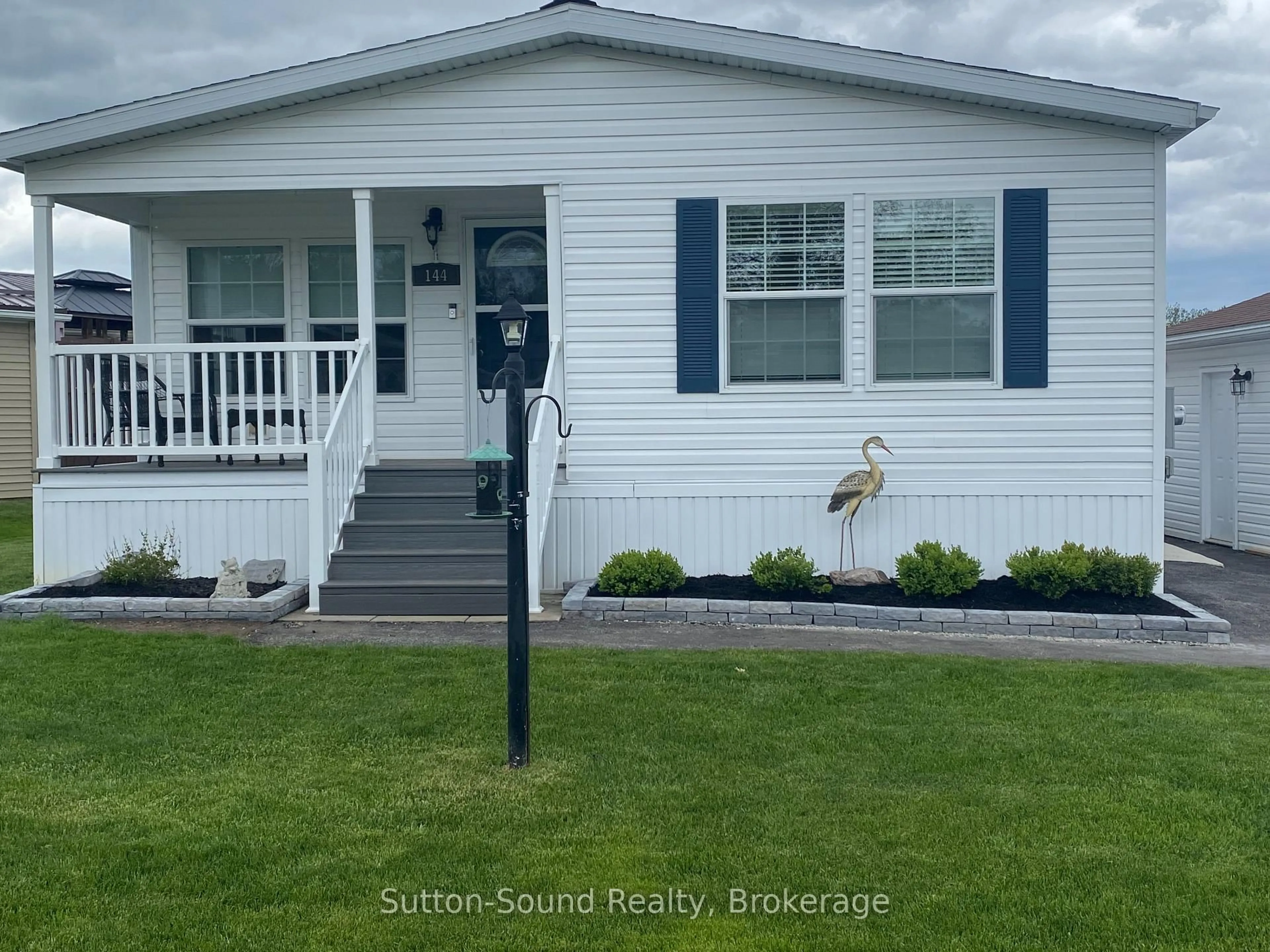 Home with vinyl exterior material, water/lake/river/ocean view for 144 Rosewood Dr, Georgian Bluffs Ontario N4K 5N5