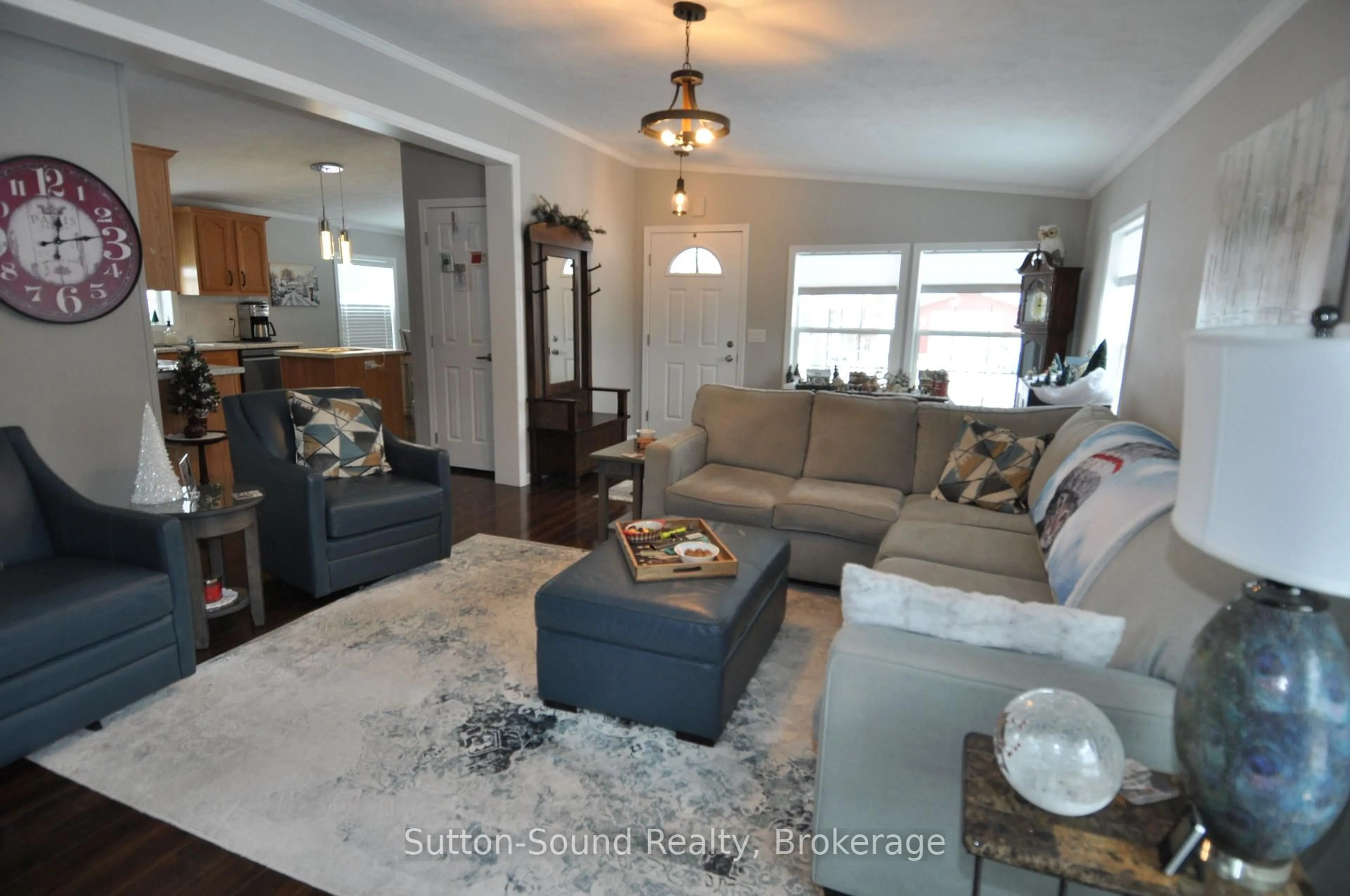 Living room with furniture, wood/laminate floor for 144 Rosewood Dr, Georgian Bluffs Ontario N4K 5N5