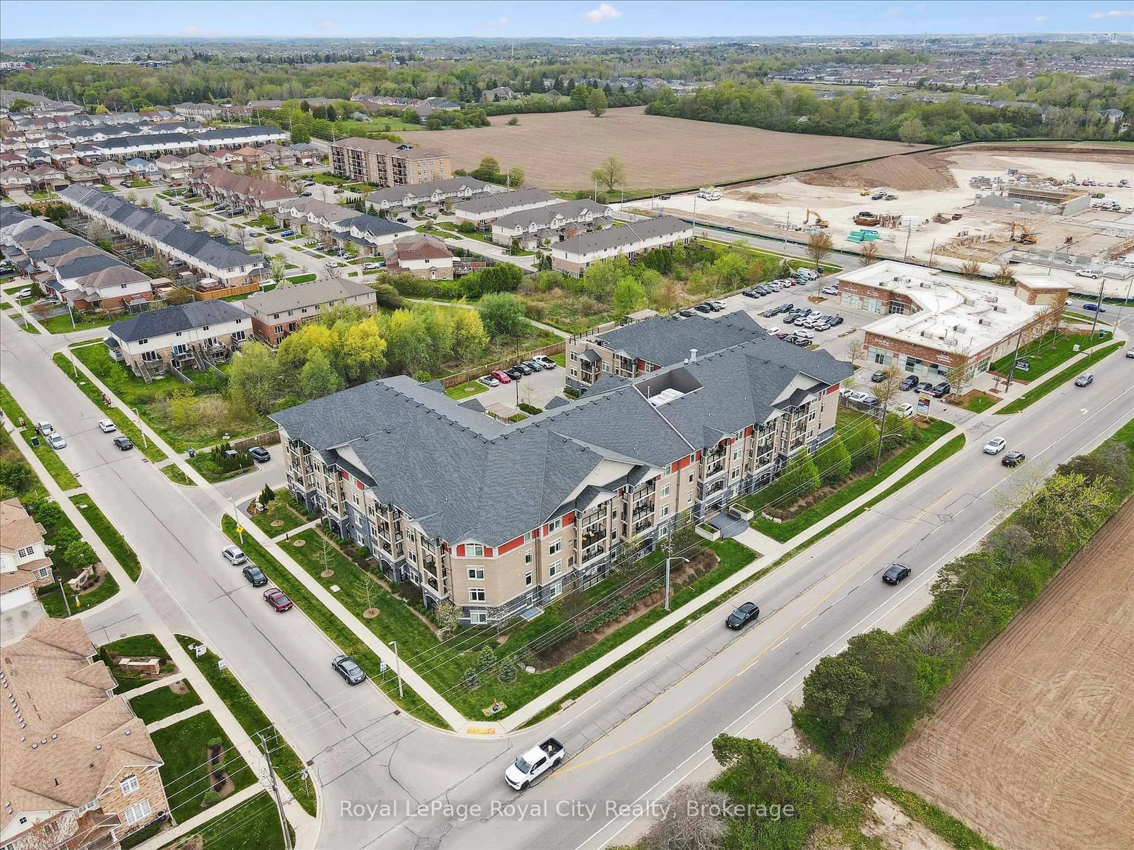 A pic from outside/outdoor area/front of a property/back of a property/a pic from drone, unknown for 106 Bard Blvd #202, Guelph Ontario N1L 0L8