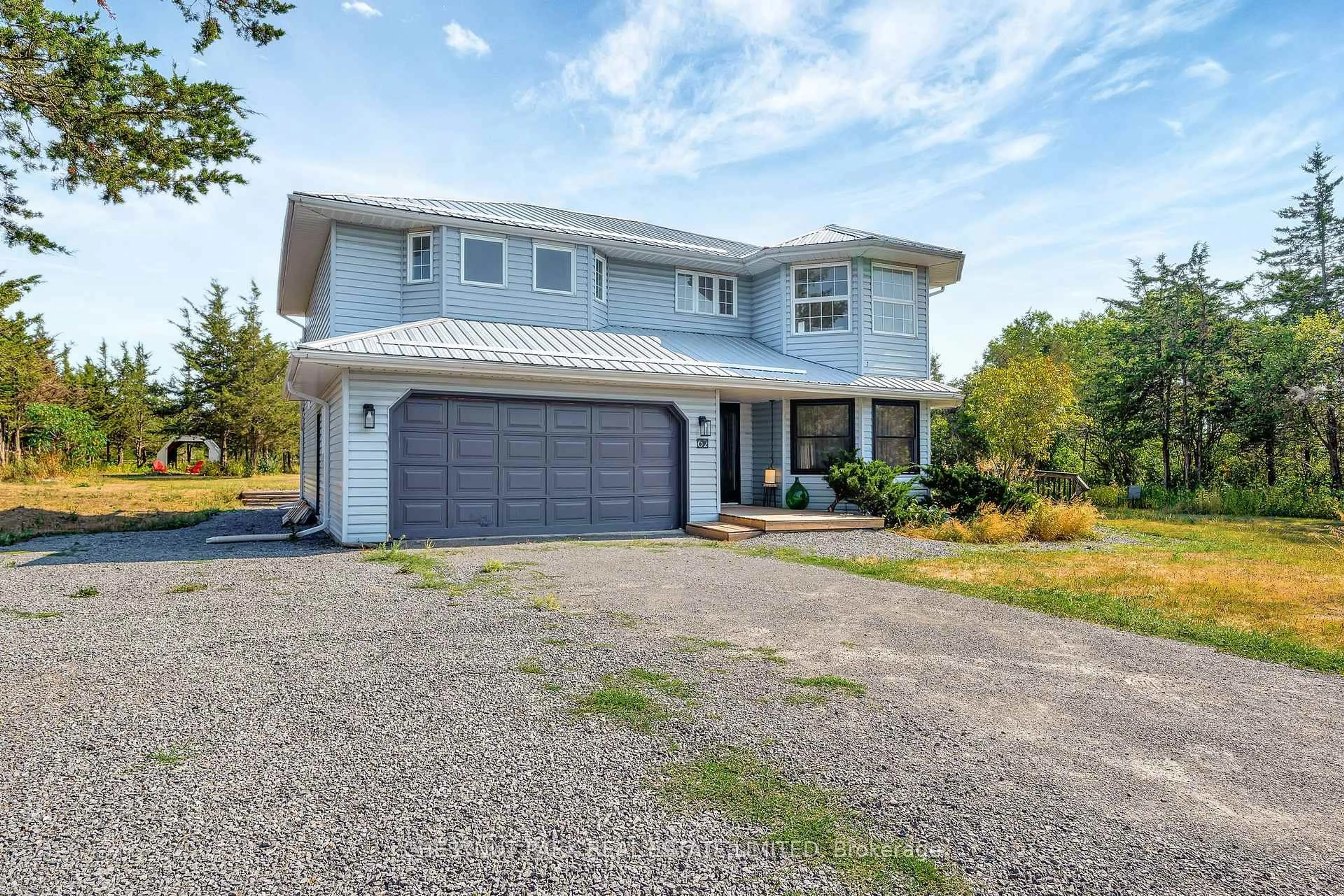 Home with vinyl exterior material, street for 62 Mitchells Crossroad, Prince Edward County Ontario K0K 2T0