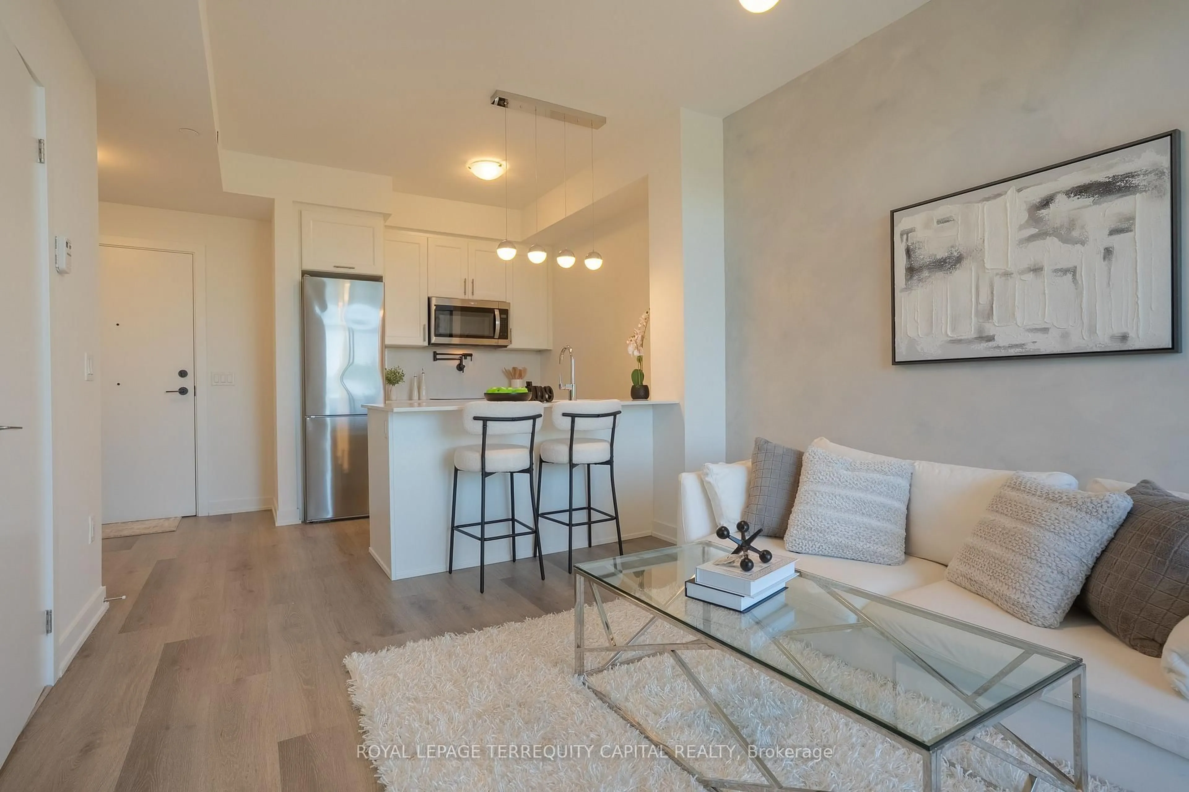 Living room with furniture, unknown for 600 North Service Rd #313, Hamilton Ontario L8E 0L2