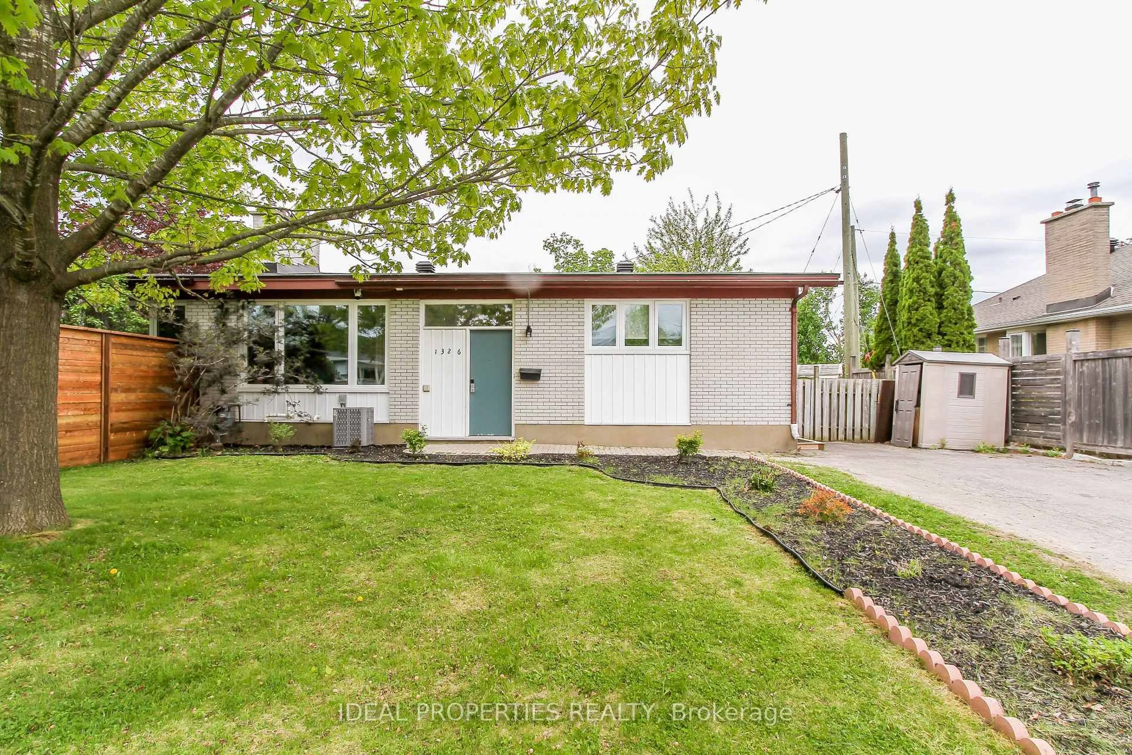 Home with vinyl exterior material, street for 1326 Tara Dr, Ottawa Ontario K2C 0S7