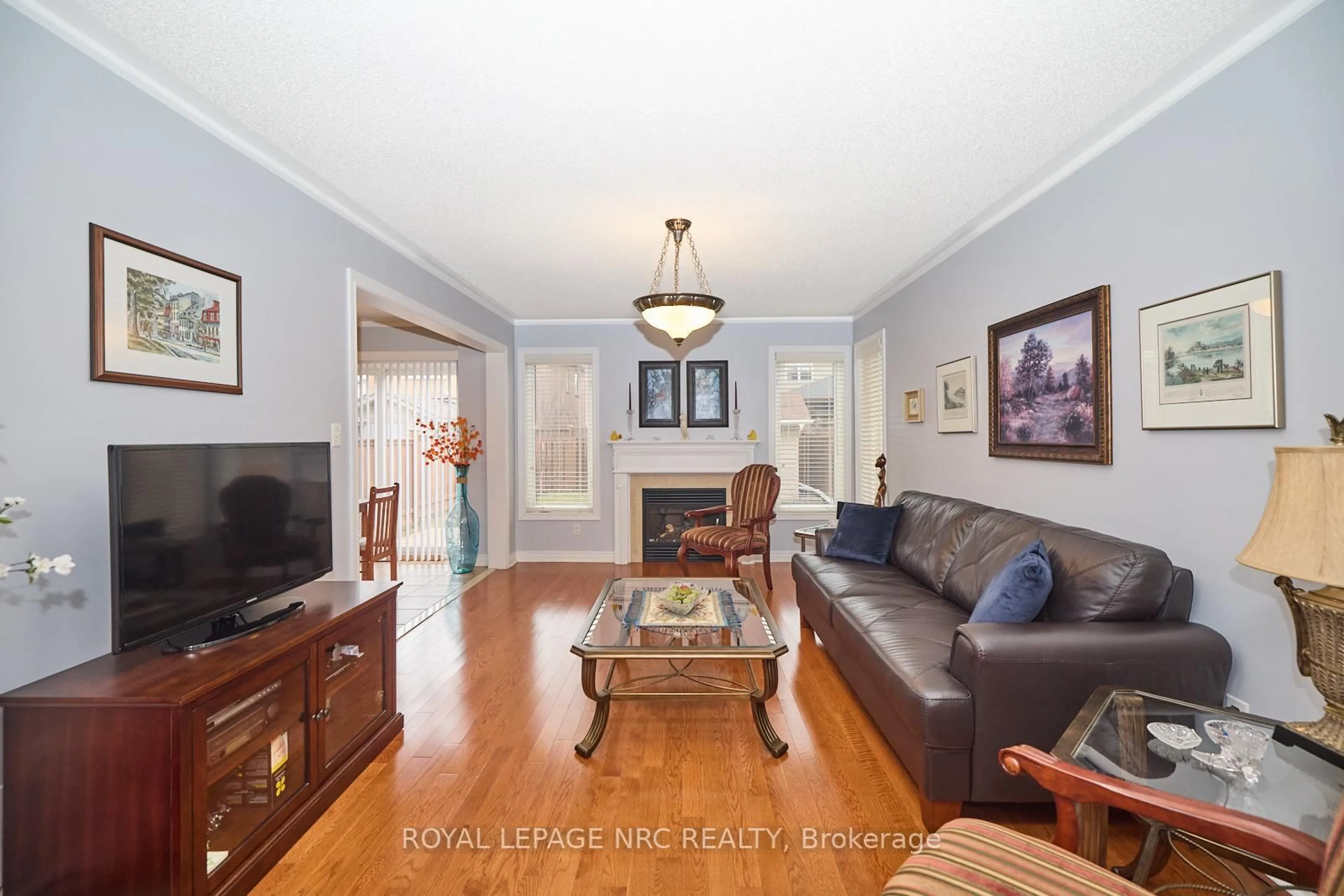 Living room with furniture, wood/laminate floor for 4 Alex Grant Pl, St. Catharines Ontario L2P 0A2