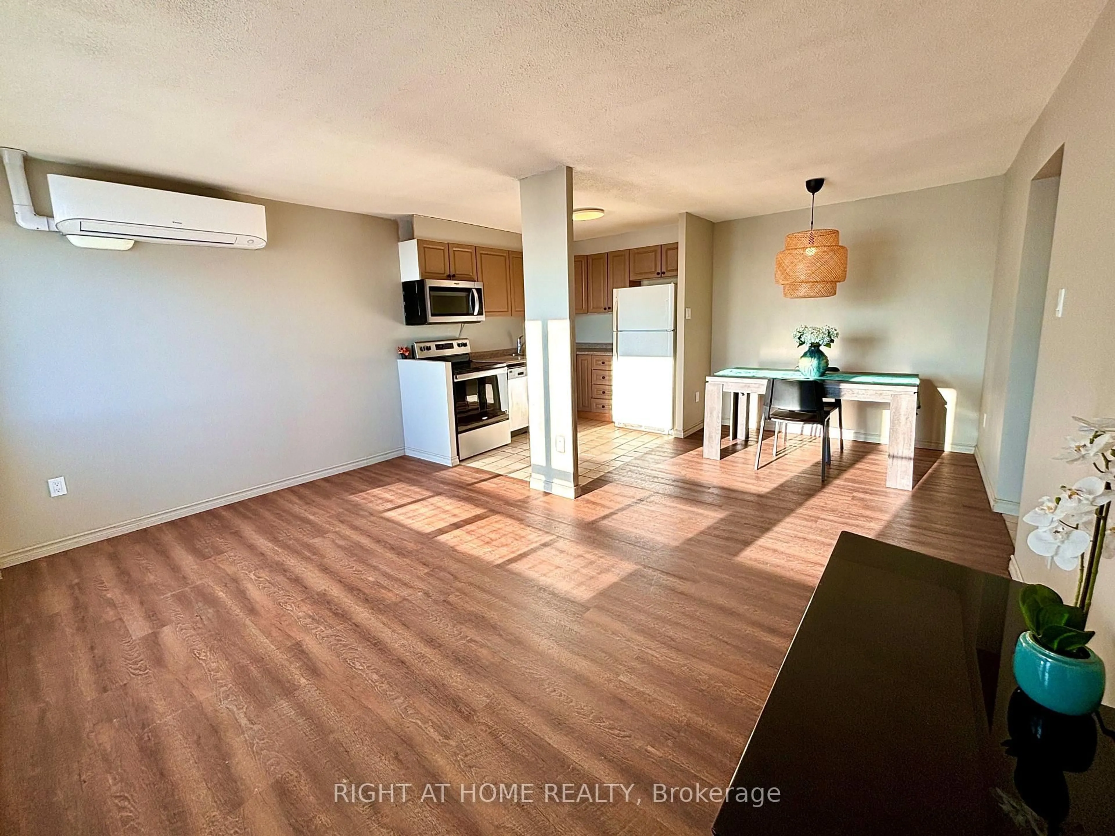 Open concept kitchen, wood/laminate floor for 20 Chesterton Dr #707, Ottawa Ontario K2E 6Z7