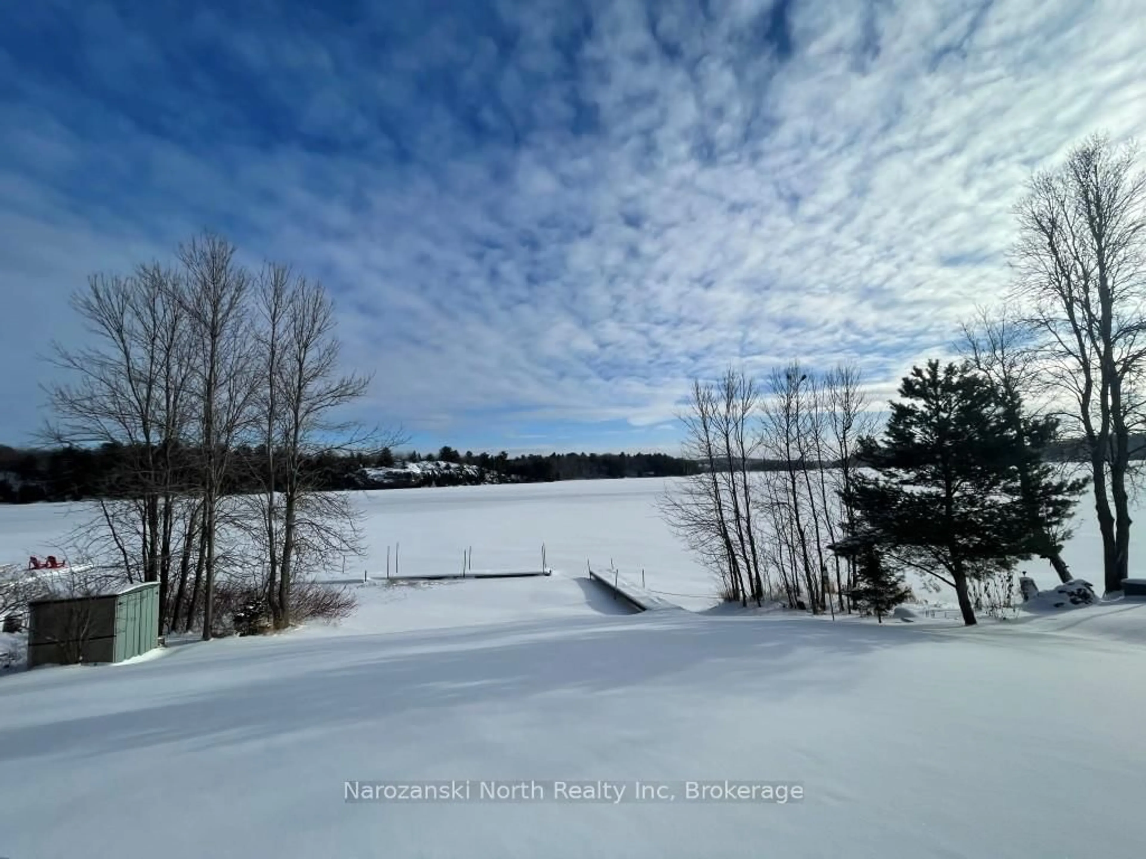 A pic from outside/outdoor area/front of a property/back of a property/a pic from drone, water/lake/river/ocean view for 57 Lise St, French River Ontario P0M 1A0