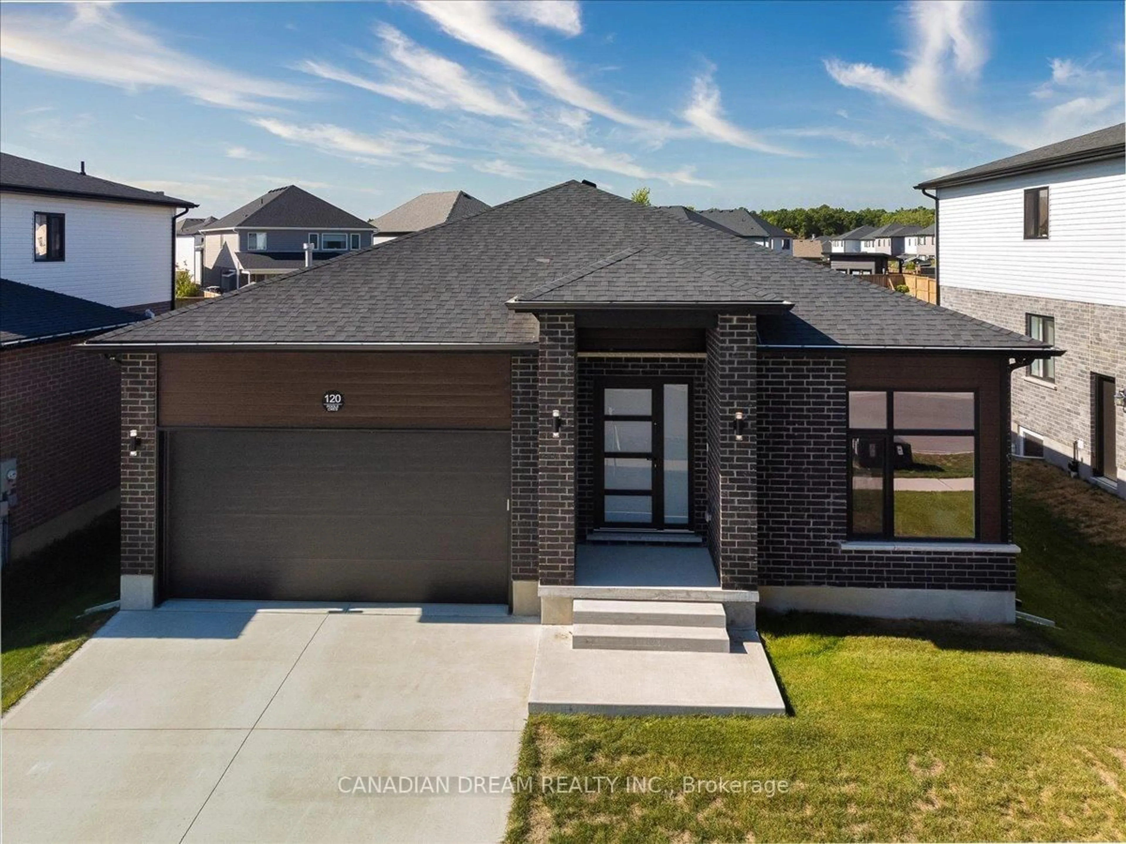 Home with brick exterior material, street for 120 Poole Cres, Middlesex Centre Ontario N0L 1R0