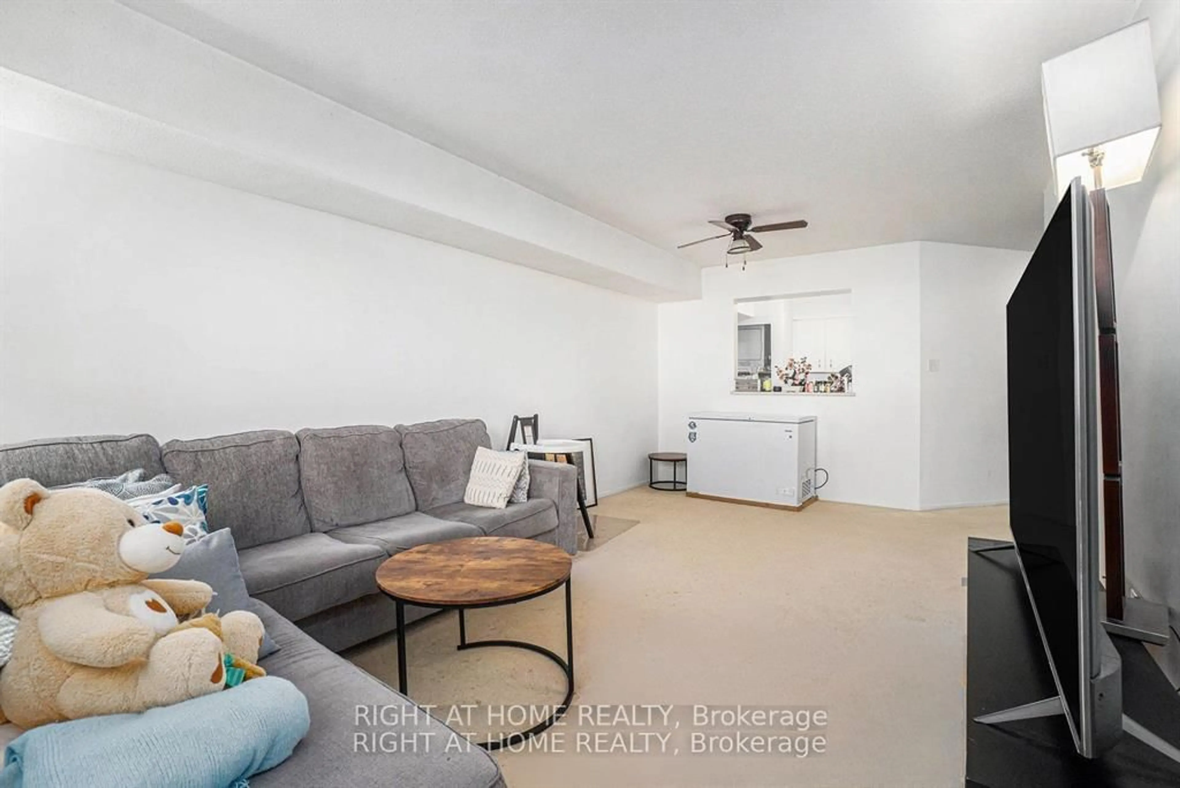 Living room with furniture, unknown for 318 Lorry Greenberg Dr #107, Ottawa Ontario K1T 2R5