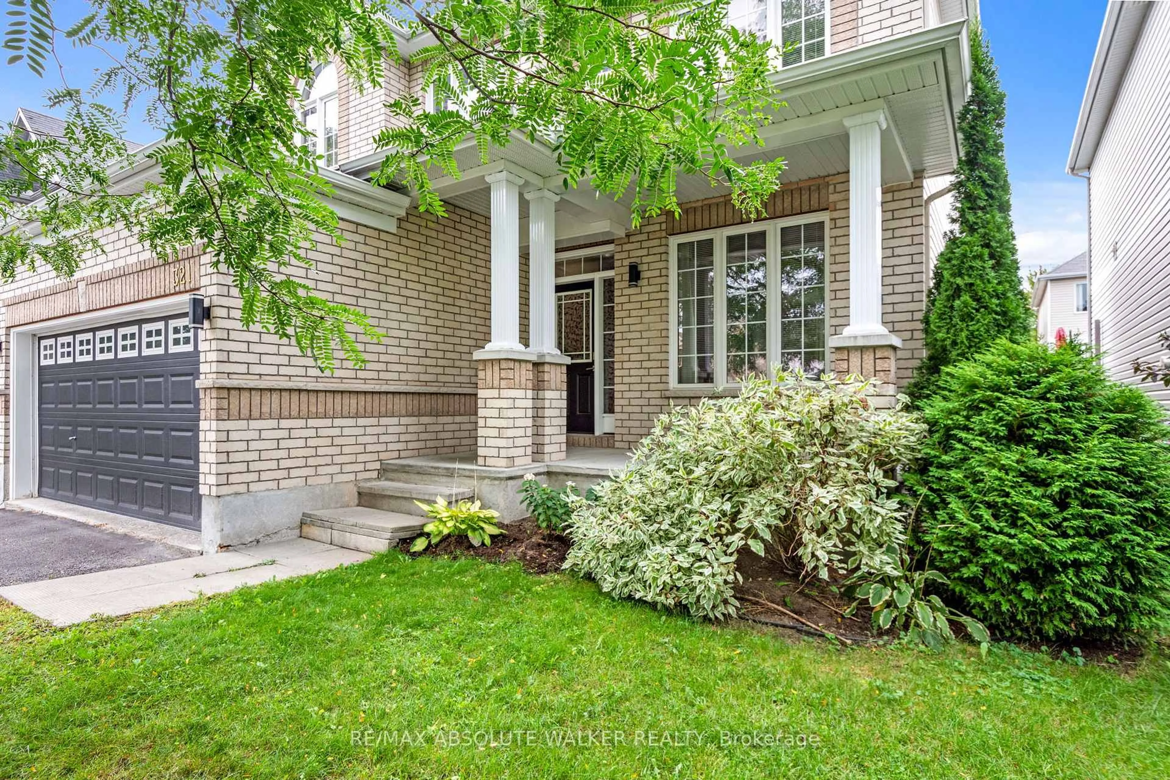 Home with brick exterior material, street for 321 Upcountry Dr, Ottawa Ontario K2S 2H6