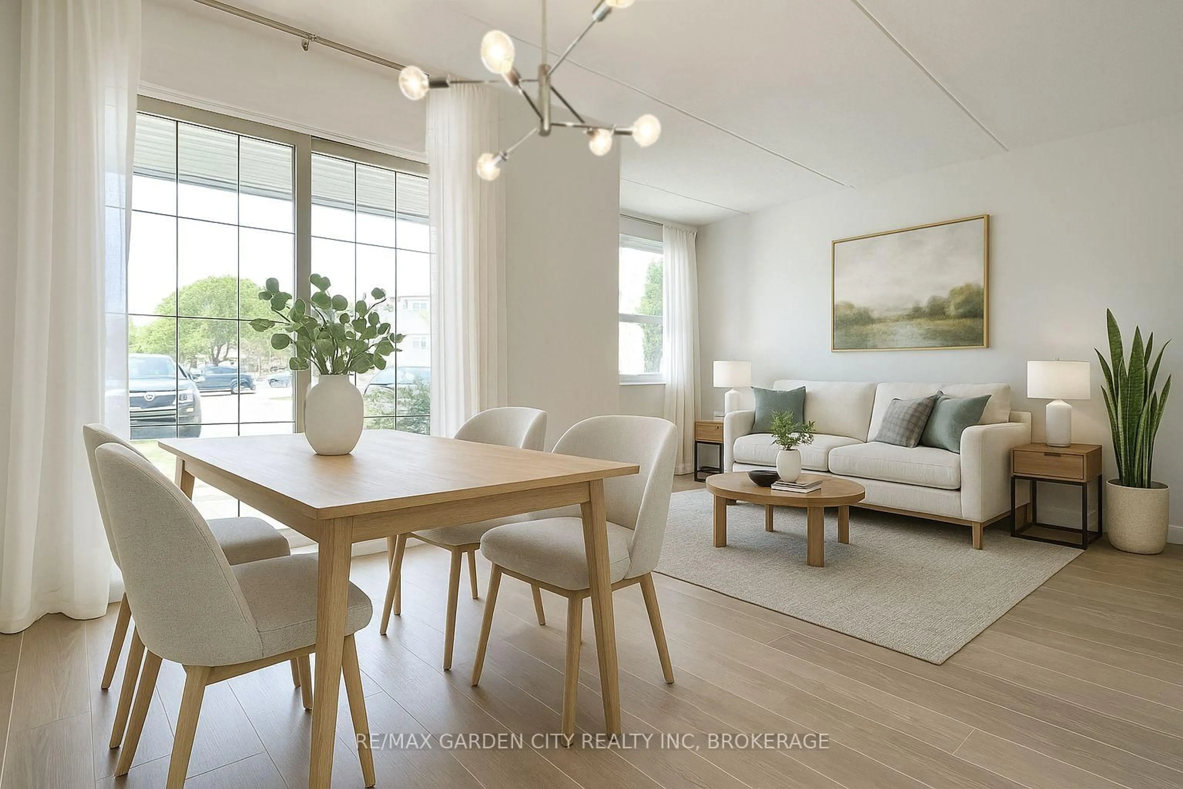 Living room with furniture, wood/laminate floor for 41 Rykert St #311, St. Catharines Ontario L2S 3A4