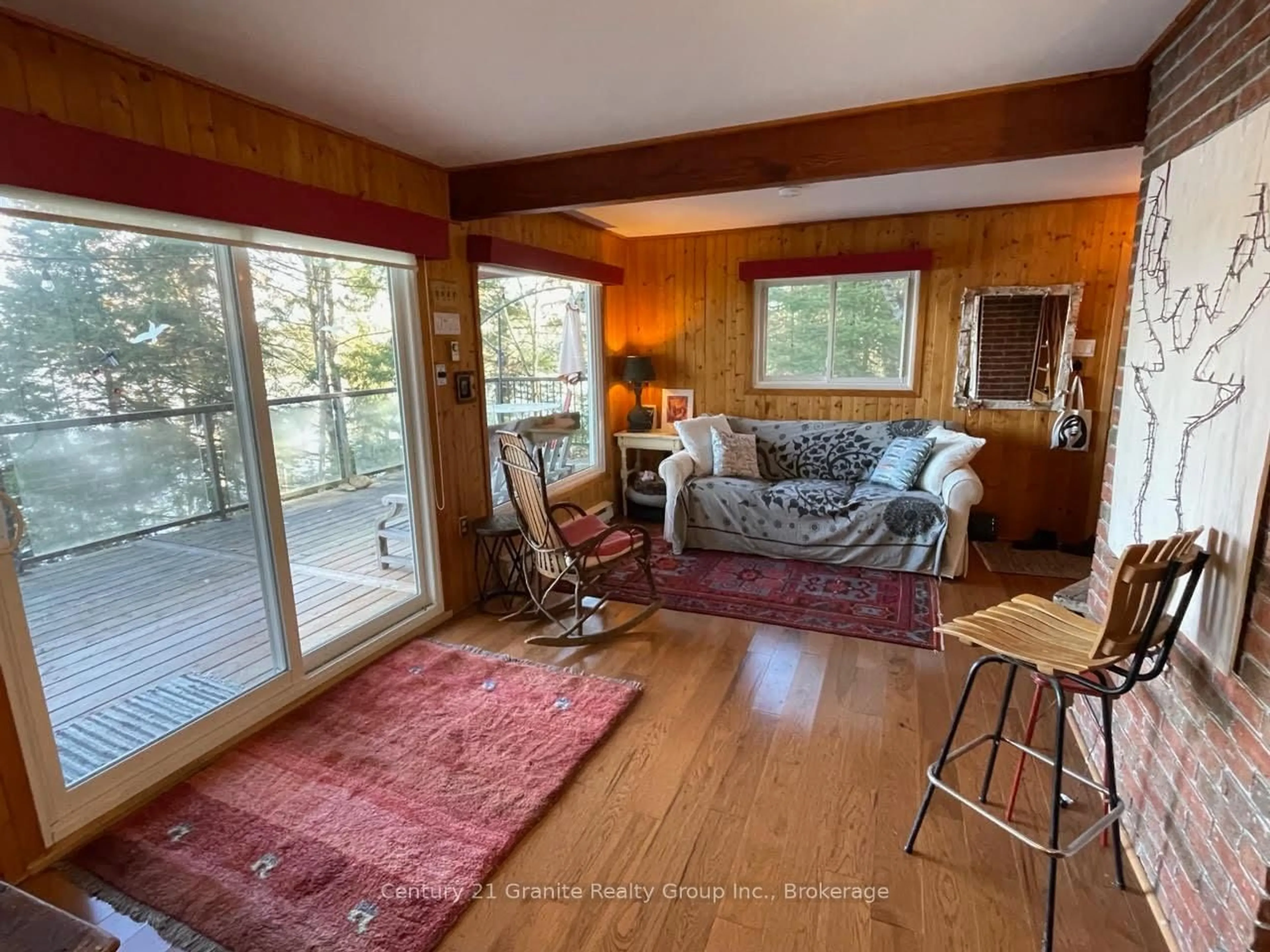 Living room with furniture, wood/laminate floor for 1038 Broken Paddle Rd, Dysart et al Ontario K0M 1S0