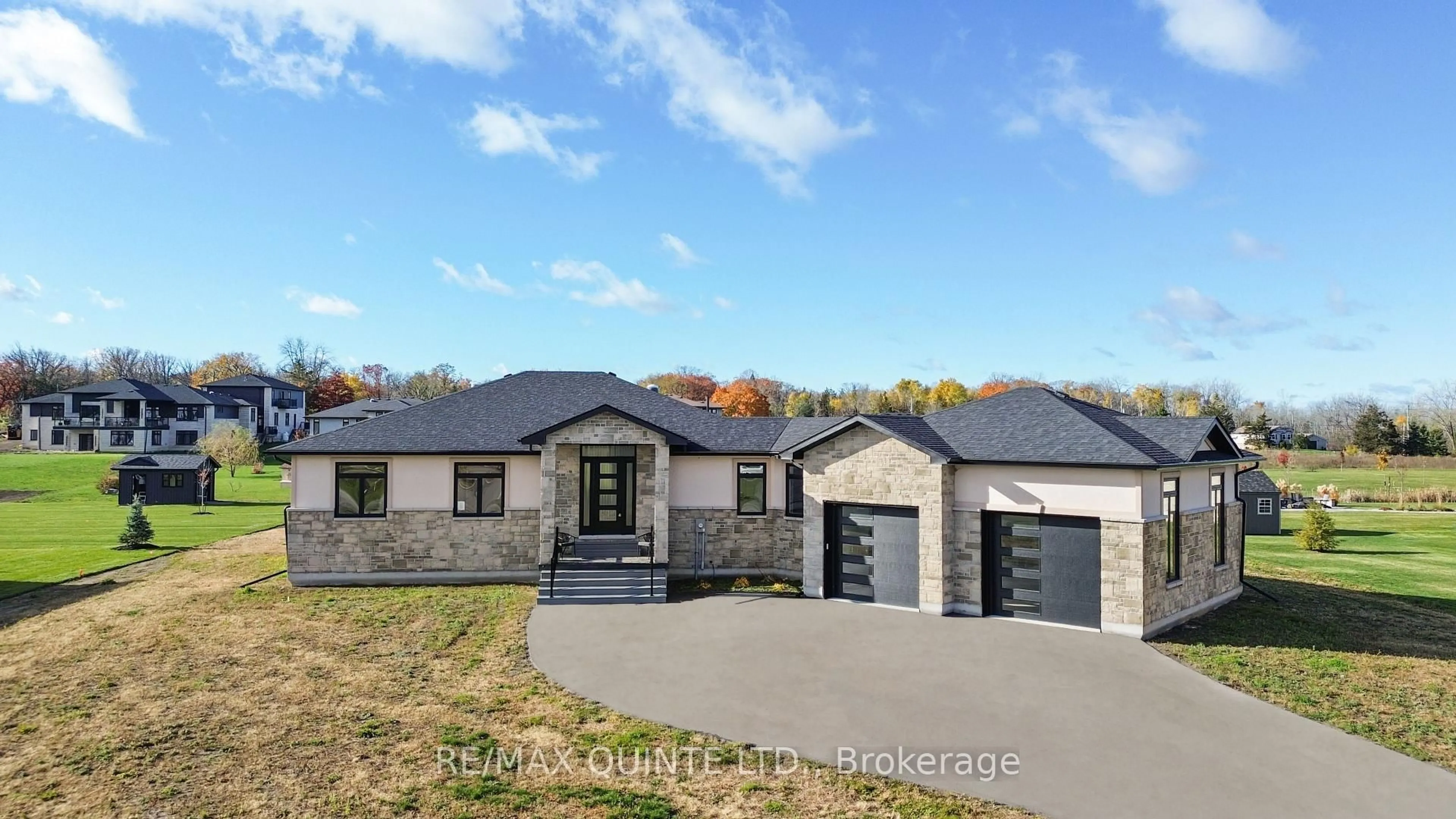 Home with brick exterior material, street for 76 Navigation Dr, Prince Edward County Ontario K8N 0G1