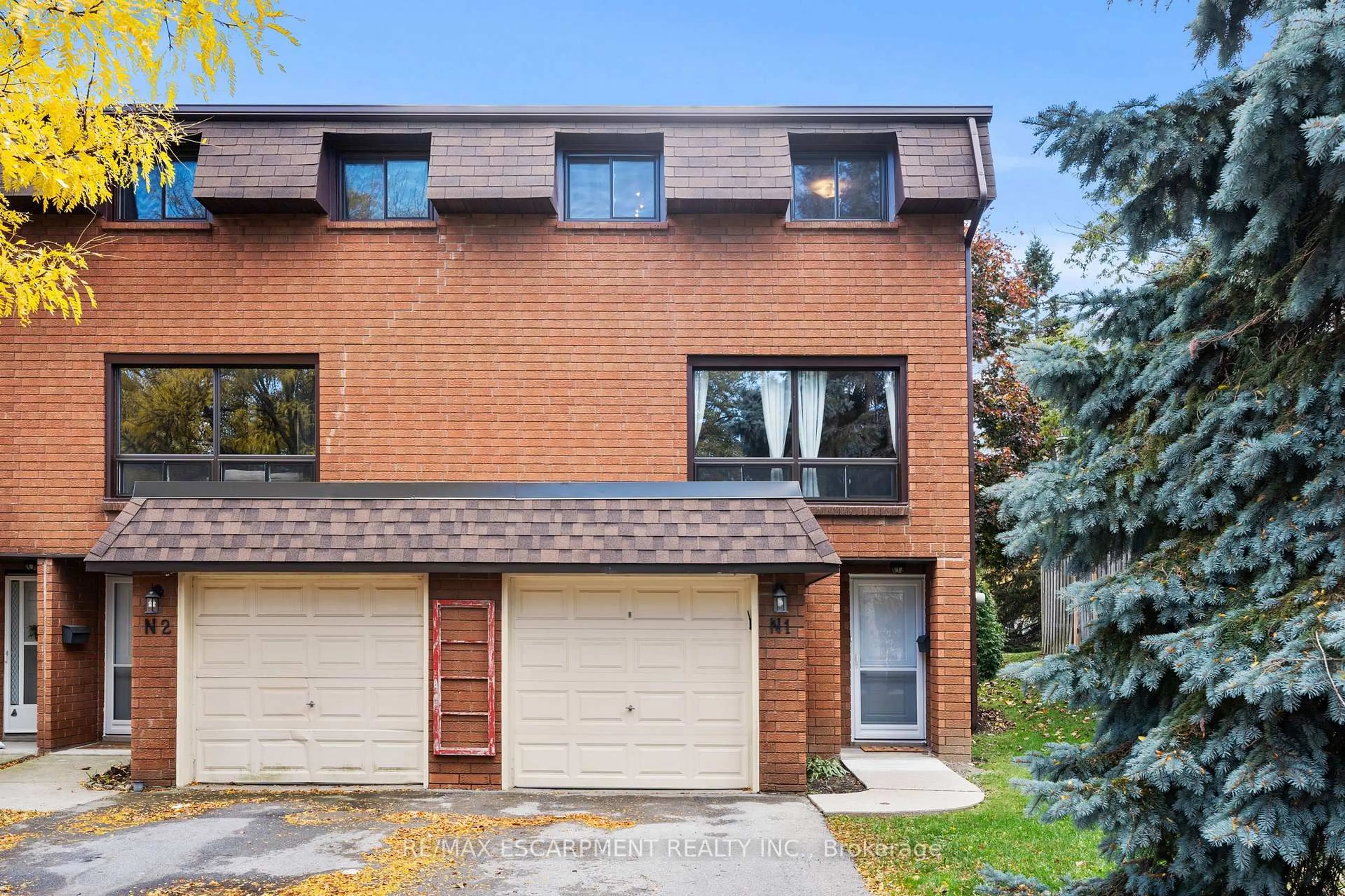 Home with brick exterior material, street for 444 Stone Church Rd #N1, Hamilton Ontario L9B 1R1