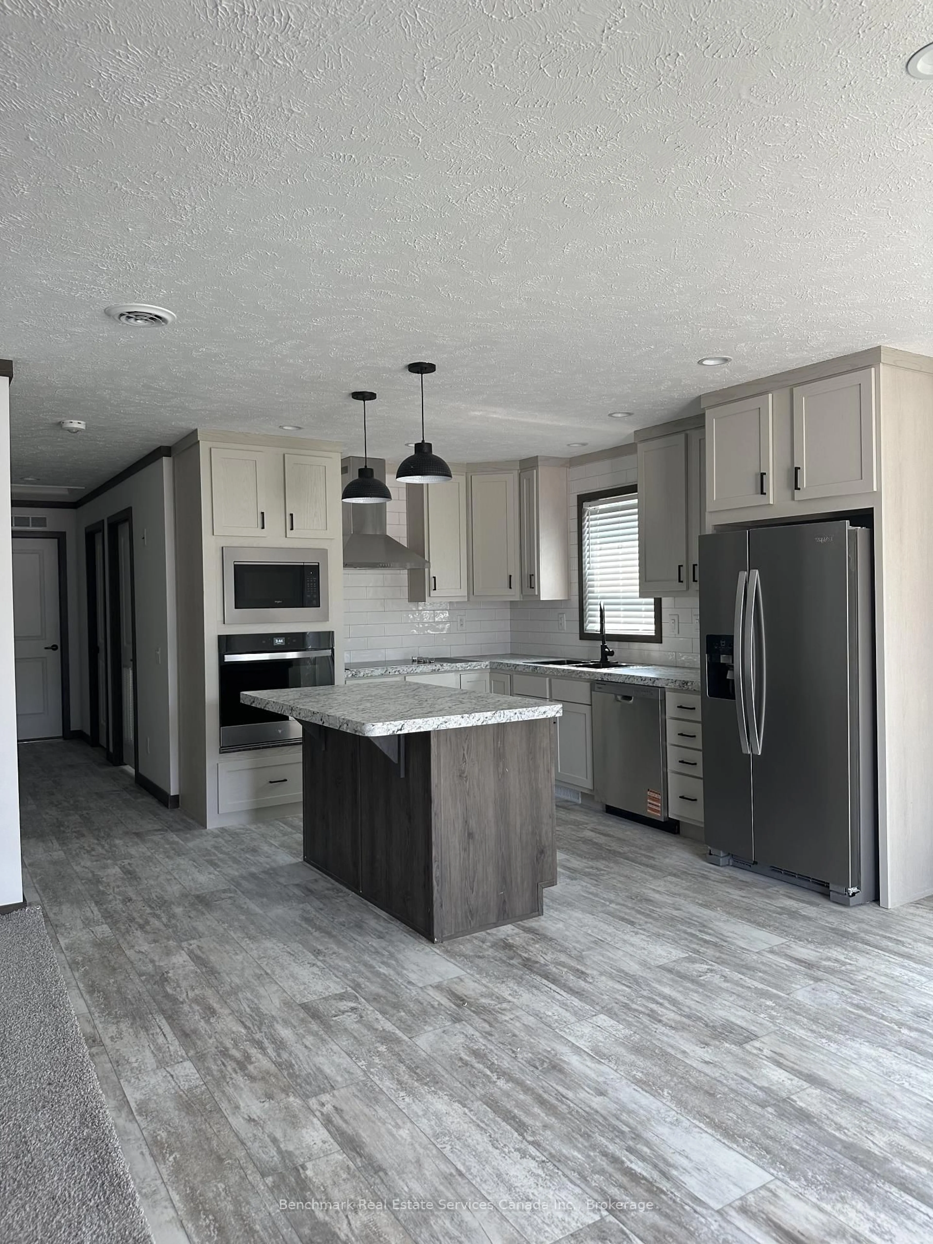Open concept kitchen, wood/laminate floor for 210 Spruce Dr, West Grey Ontario N4N 3B8