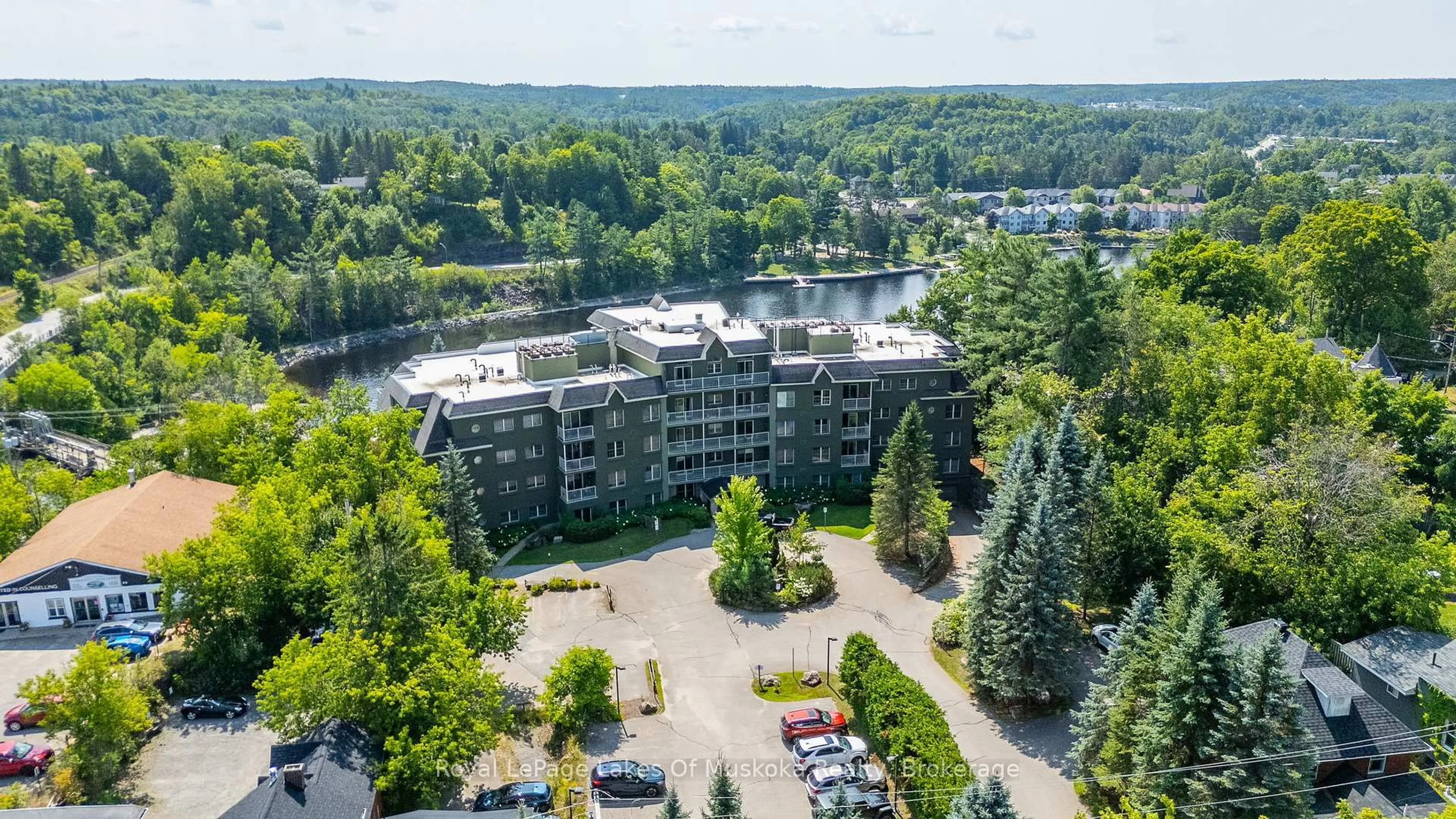 A pic from outside/outdoor area/front of a property/back of a property/a pic from drone, water/lake/river/ocean view for 24 Ontario St #308, Bracebridge Ontario P1L 2H5