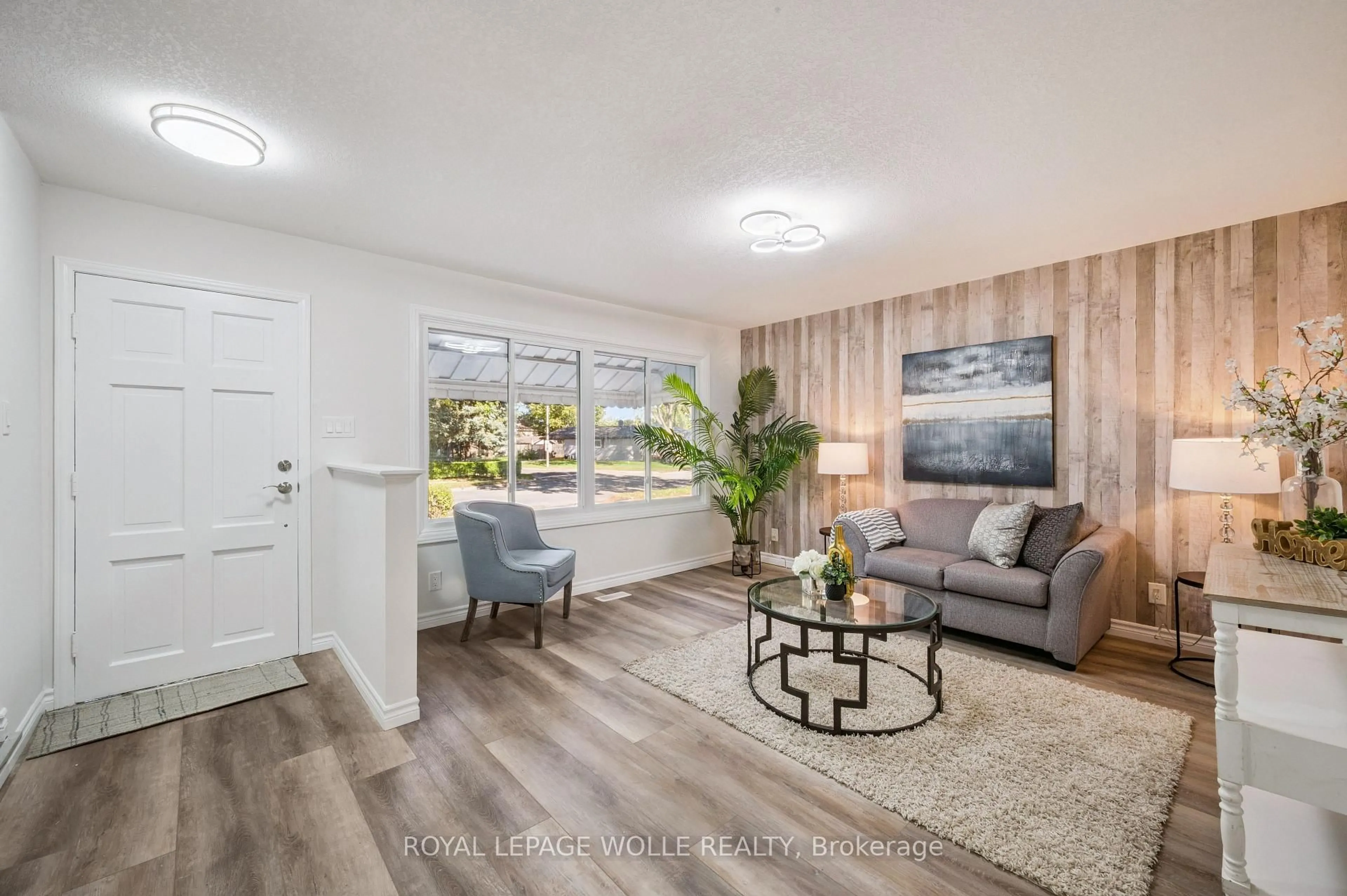 Living room with furniture, wood/laminate floor for 179 Traynor Ave, Kitchener Ontario N2C 1W4