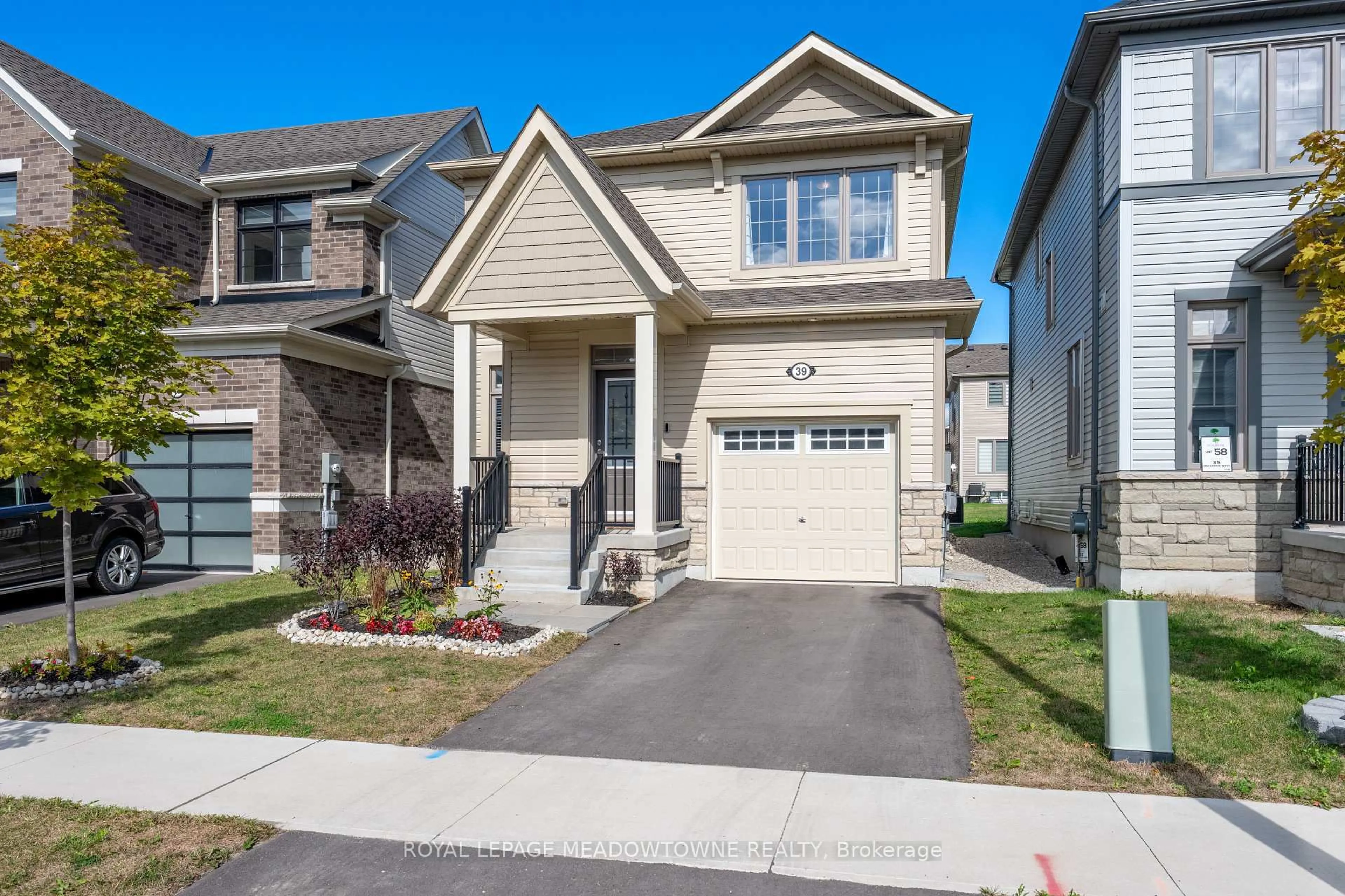 Home with vinyl exterior material, street for 39 Dass Dr, Centre Wellington Ontario N1M 0H9