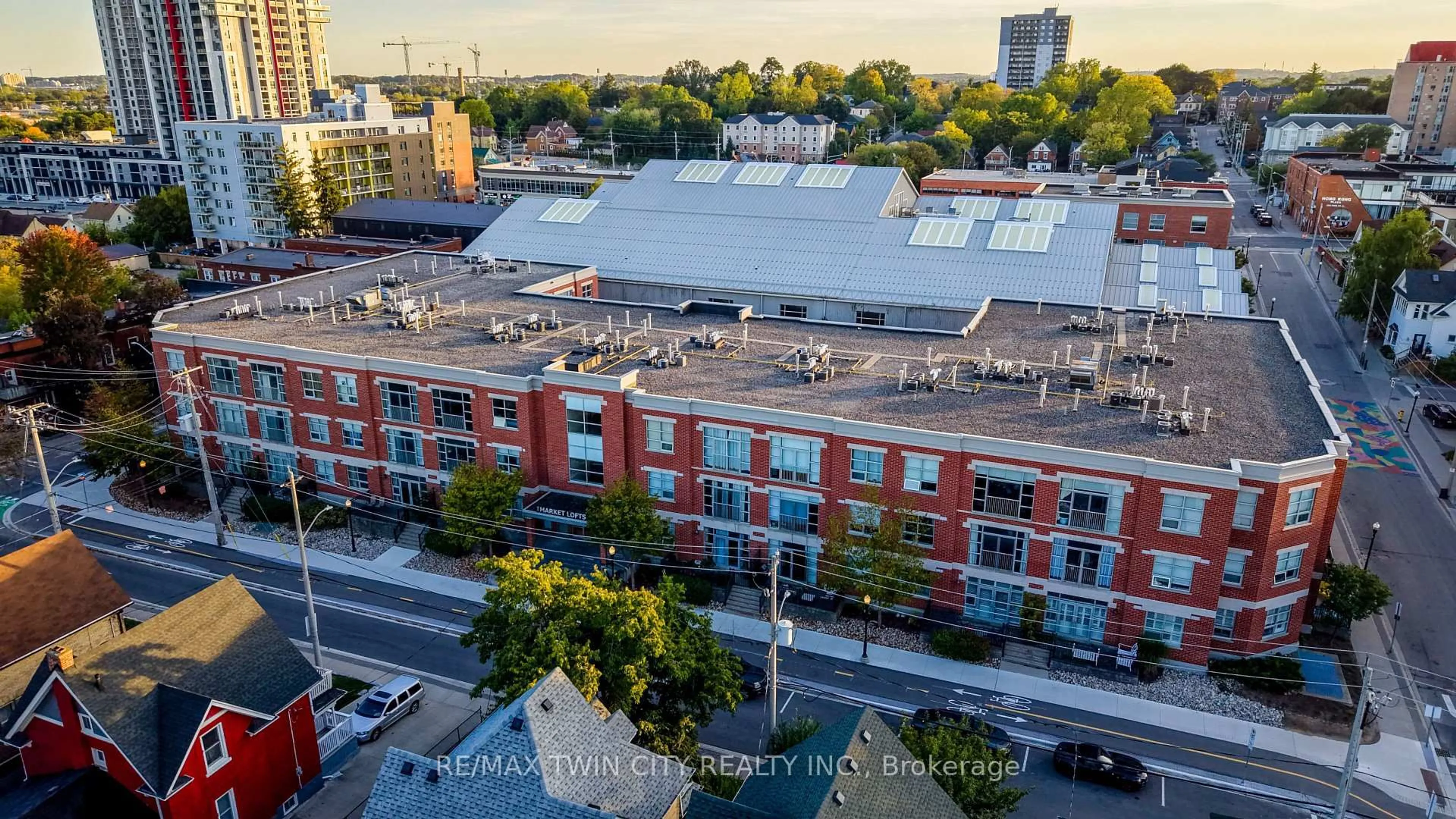 A pic from outside/outdoor area/front of a property/back of a property/a pic from drone, city buildings view from balcony for 165 Duke St #105, Kitchener Ontario N2H 6T8