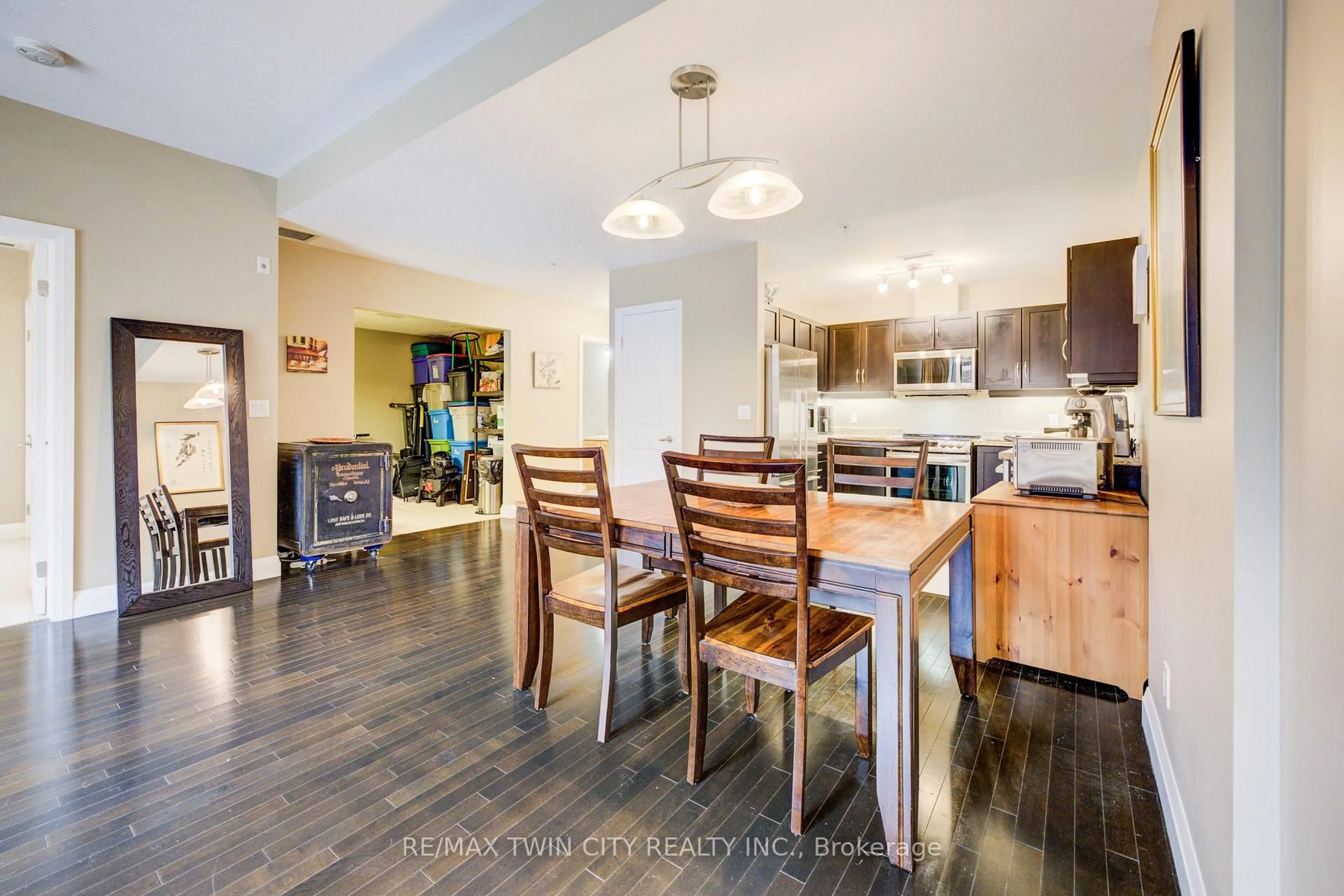 Open concept kitchen, wood/laminate floor for 165 Duke St #105, Kitchener Ontario N2H 6T8