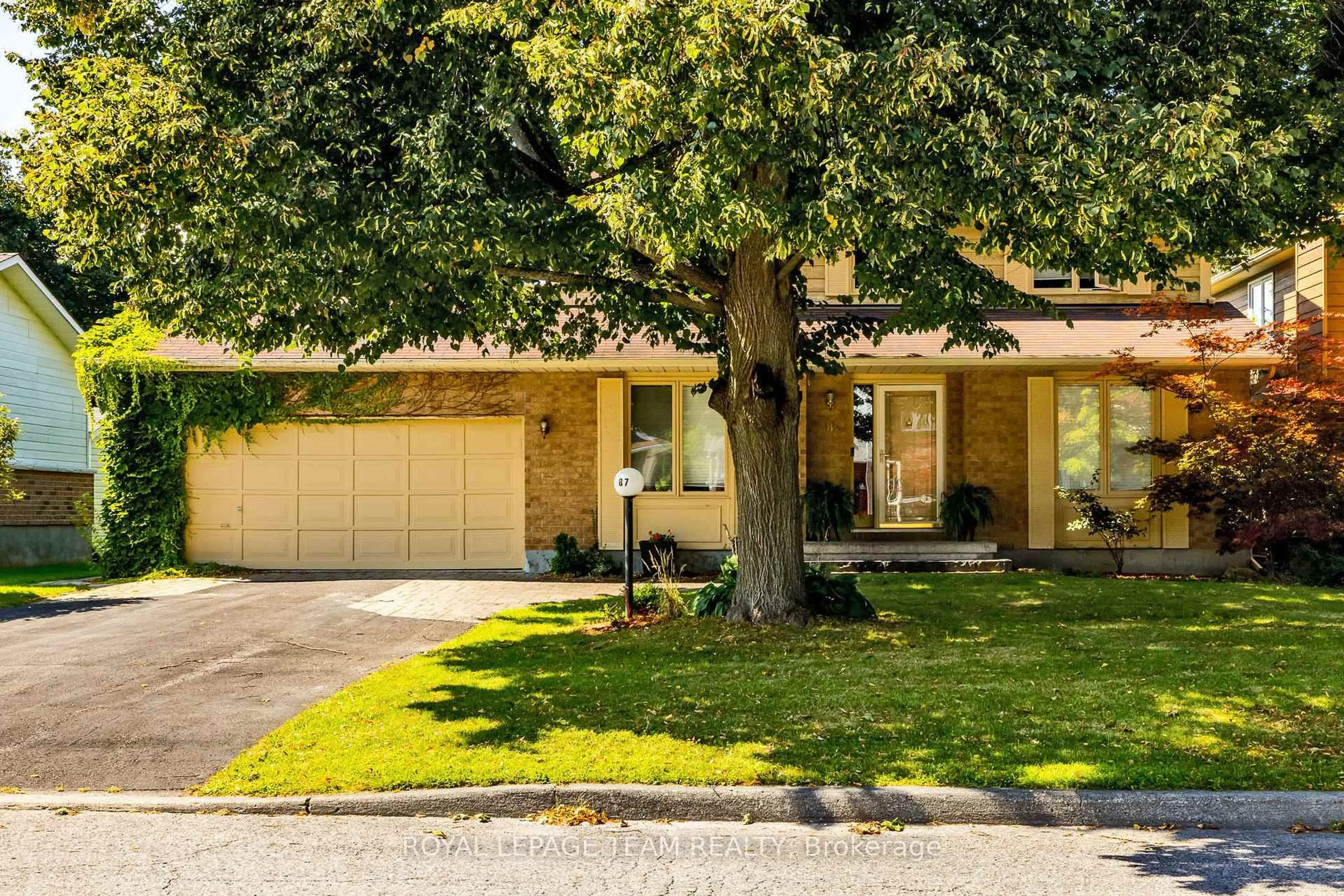 Home with brick exterior material, street for 87 BEECHFERN Dr, Stittsville Ontario K2S 1E3