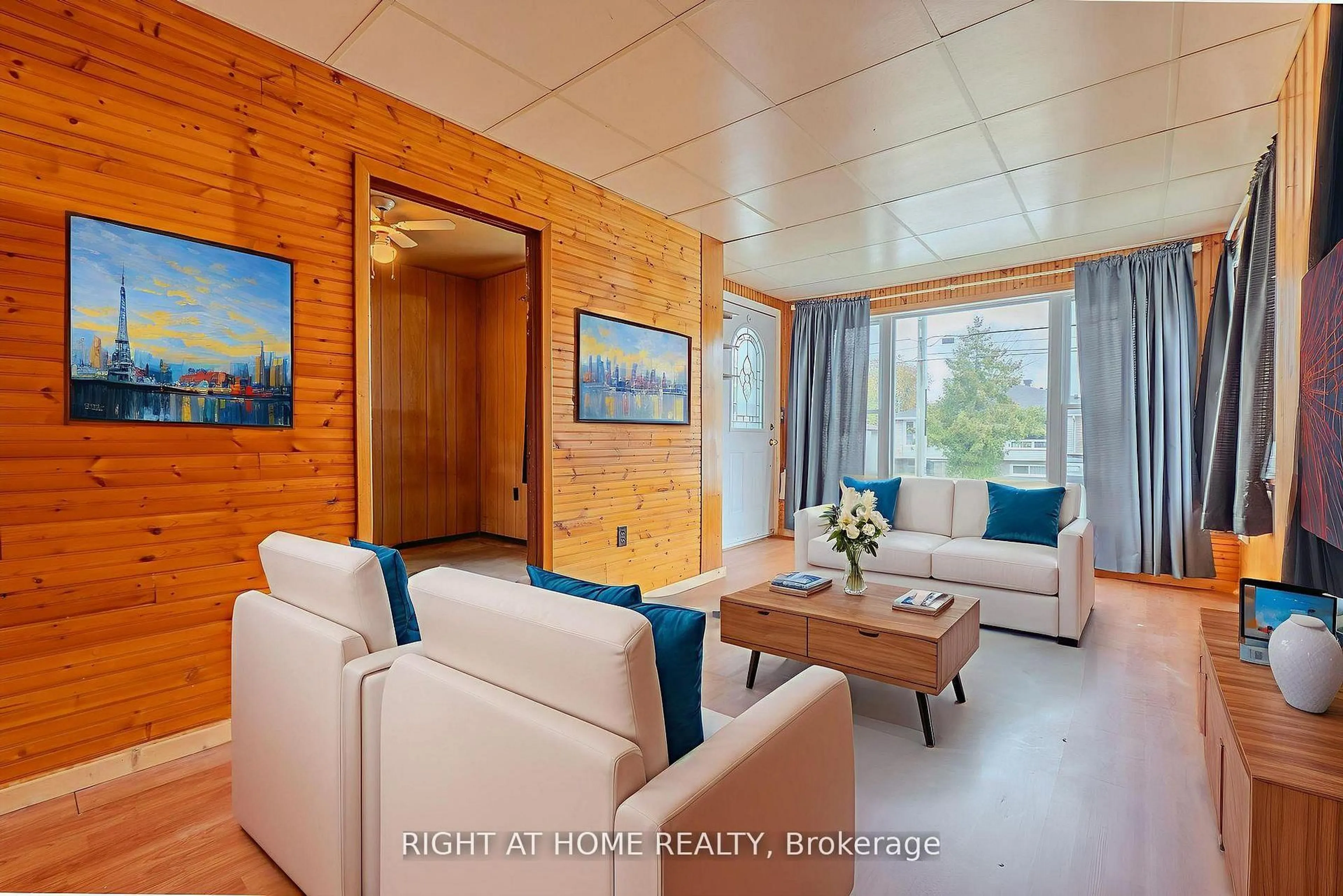 Living room with furniture, wood/laminate floor for 169 Princess St, North Bay Ontario P1B 1P8