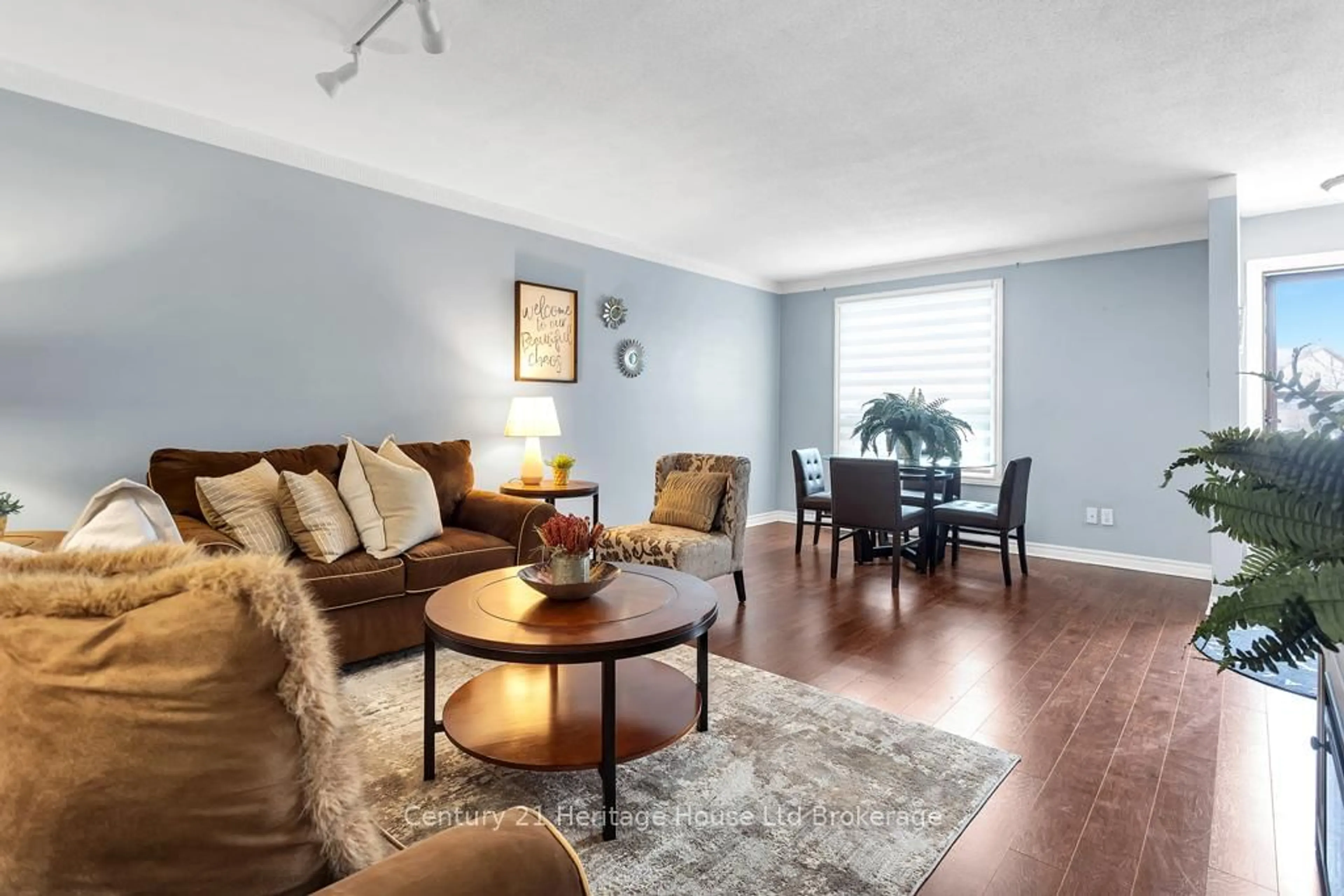 Living room with furniture, wood/laminate floor for 351 Highview Ave #11, London South Ontario N6C 5G5