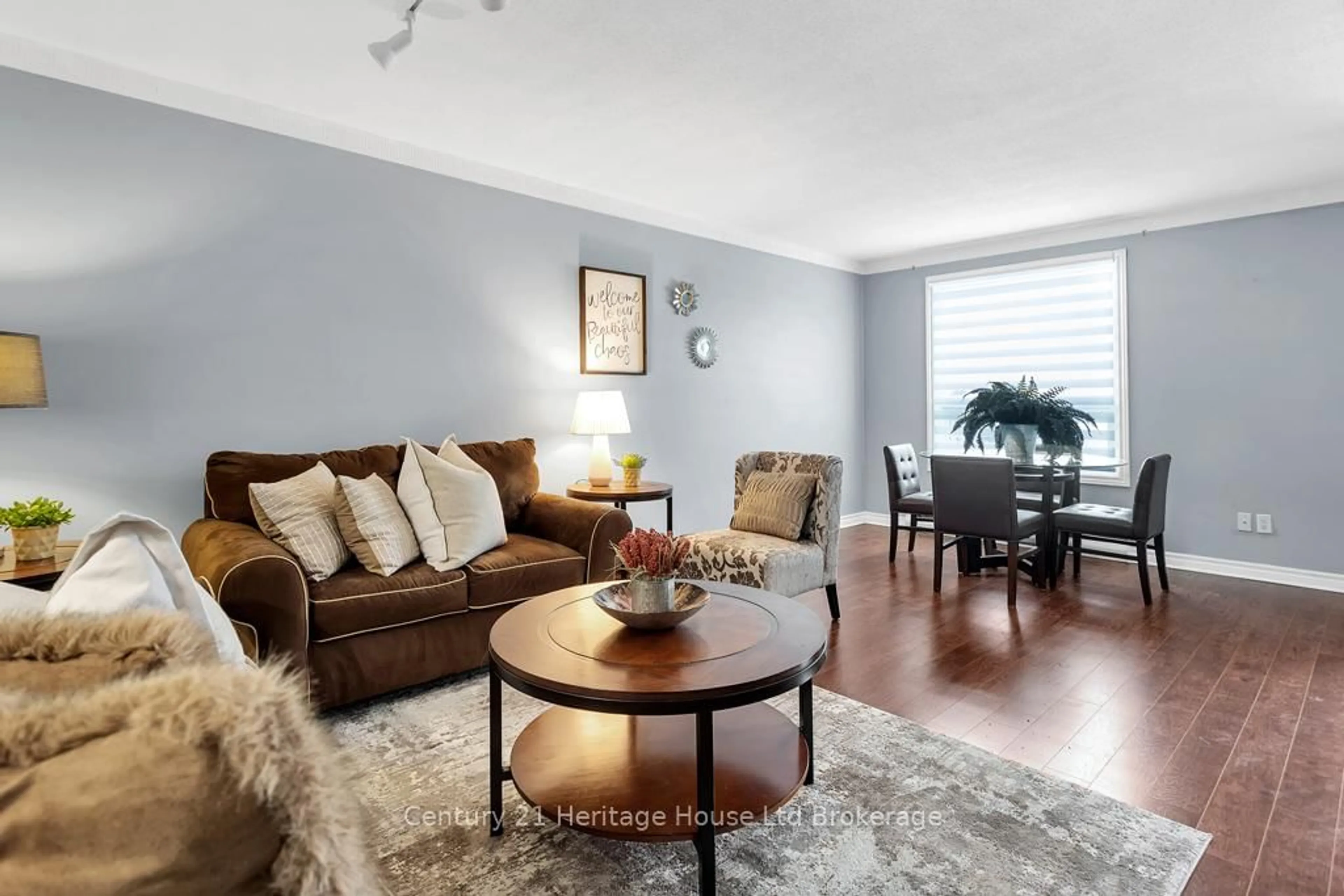 Living room with furniture, wood/laminate floor for 351 Highview Ave #11, London South Ontario N6C 5G5