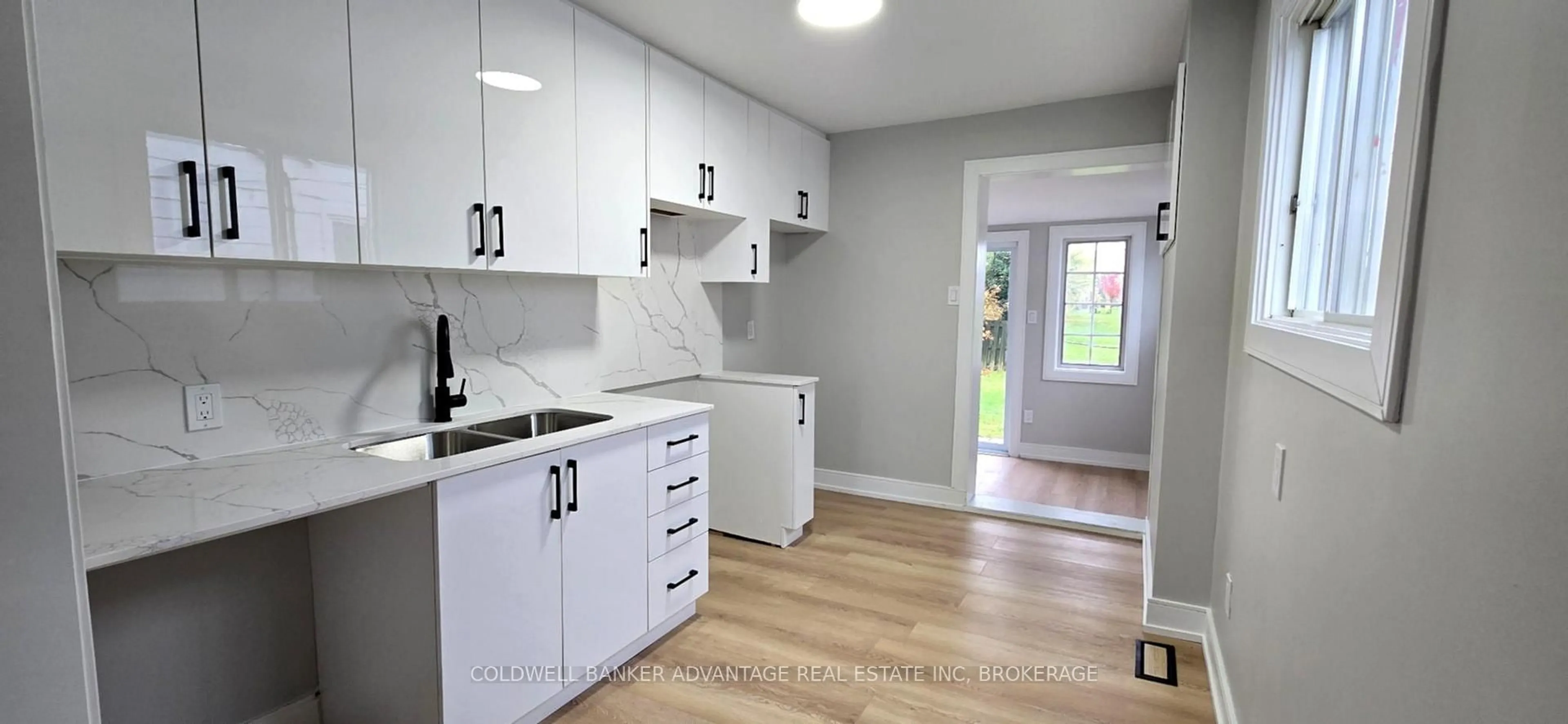 Open concept kitchen, wood/laminate floor for 321 Dieppe St, Welland Ontario L3B 4V1