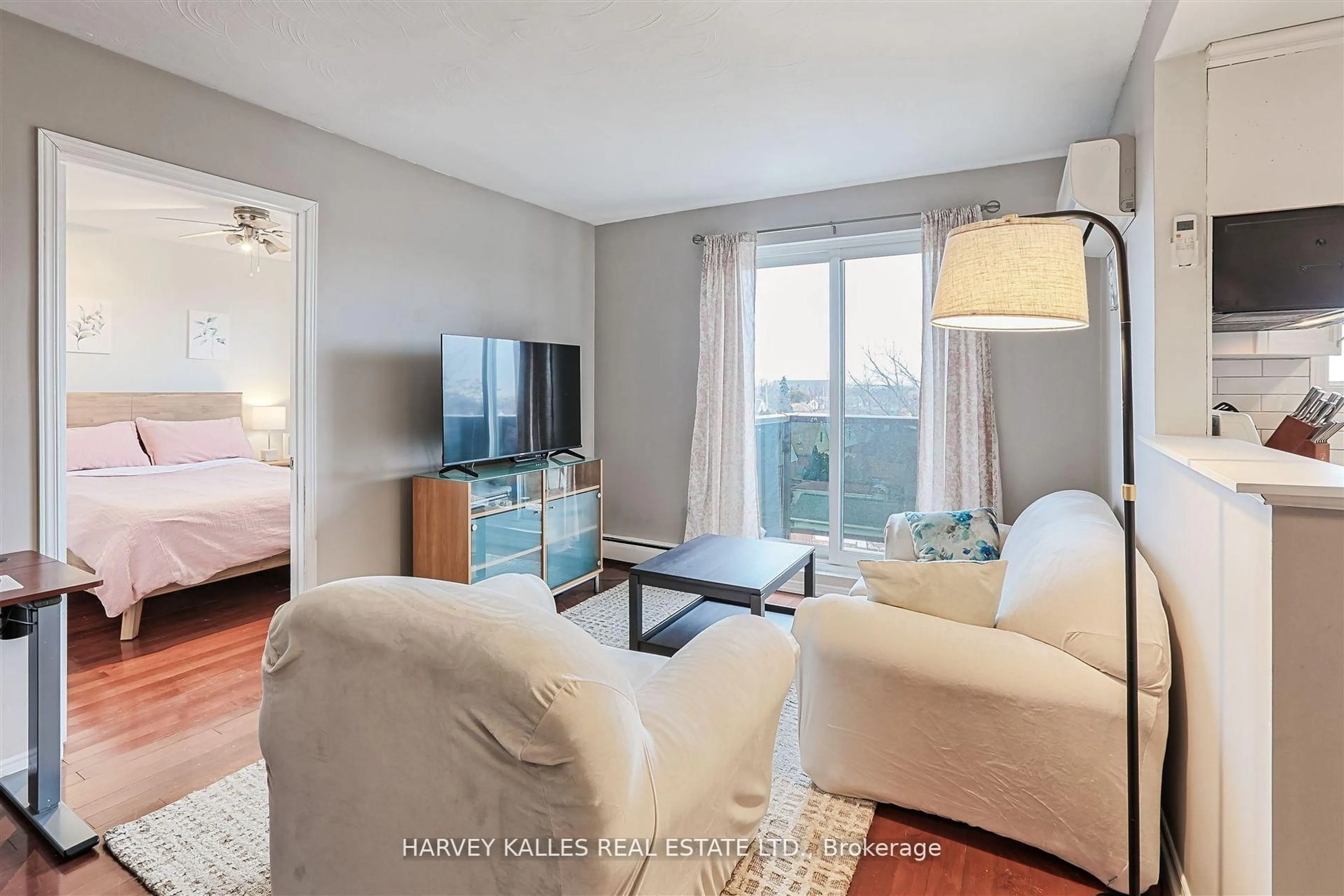 Living room with furniture, wood/laminate floor for 2373 King St #45, Hamilton Ontario L8K 1X9