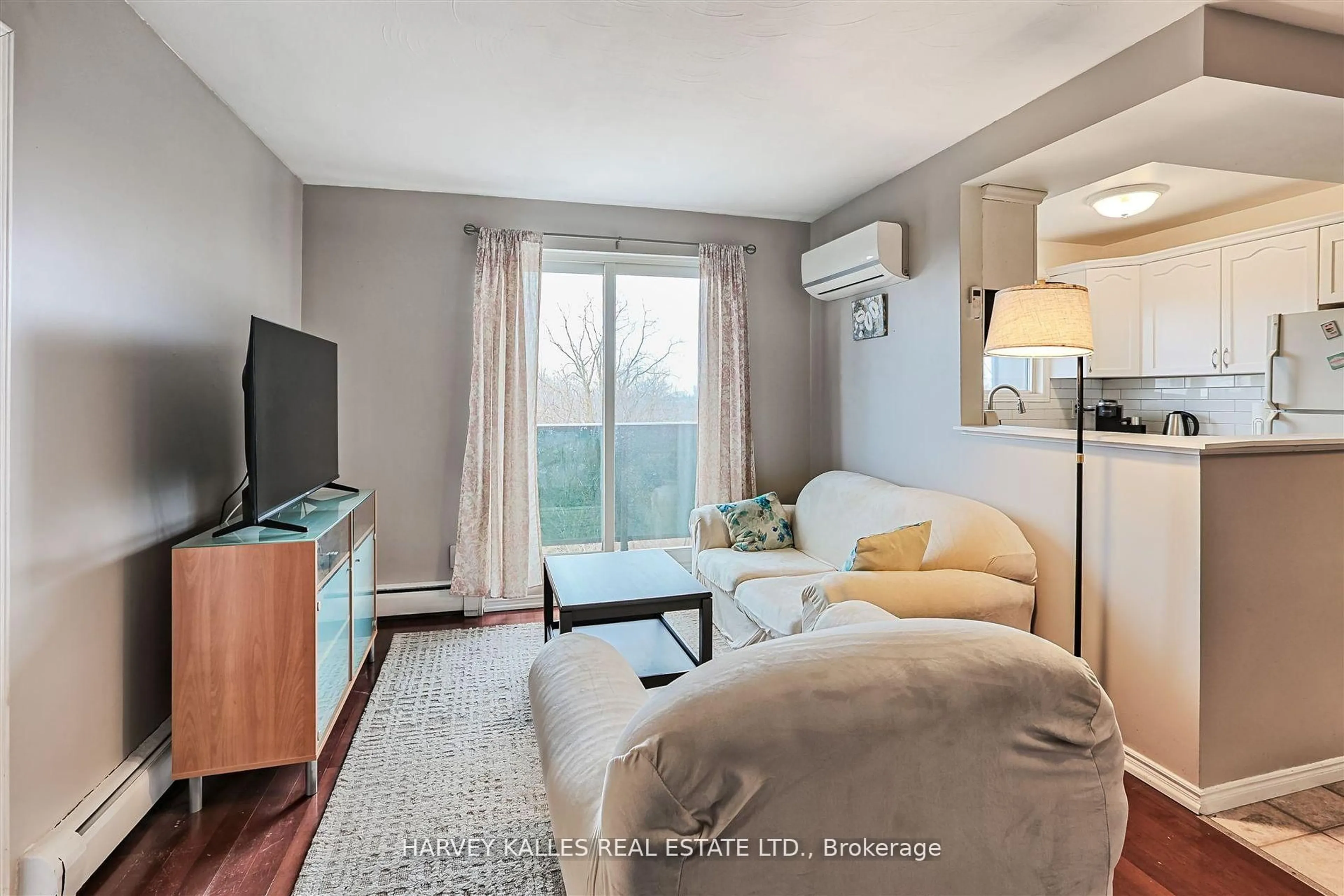 Living room with furniture, wood/laminate floor for 2373 King St #45, Hamilton Ontario L8K 1X9