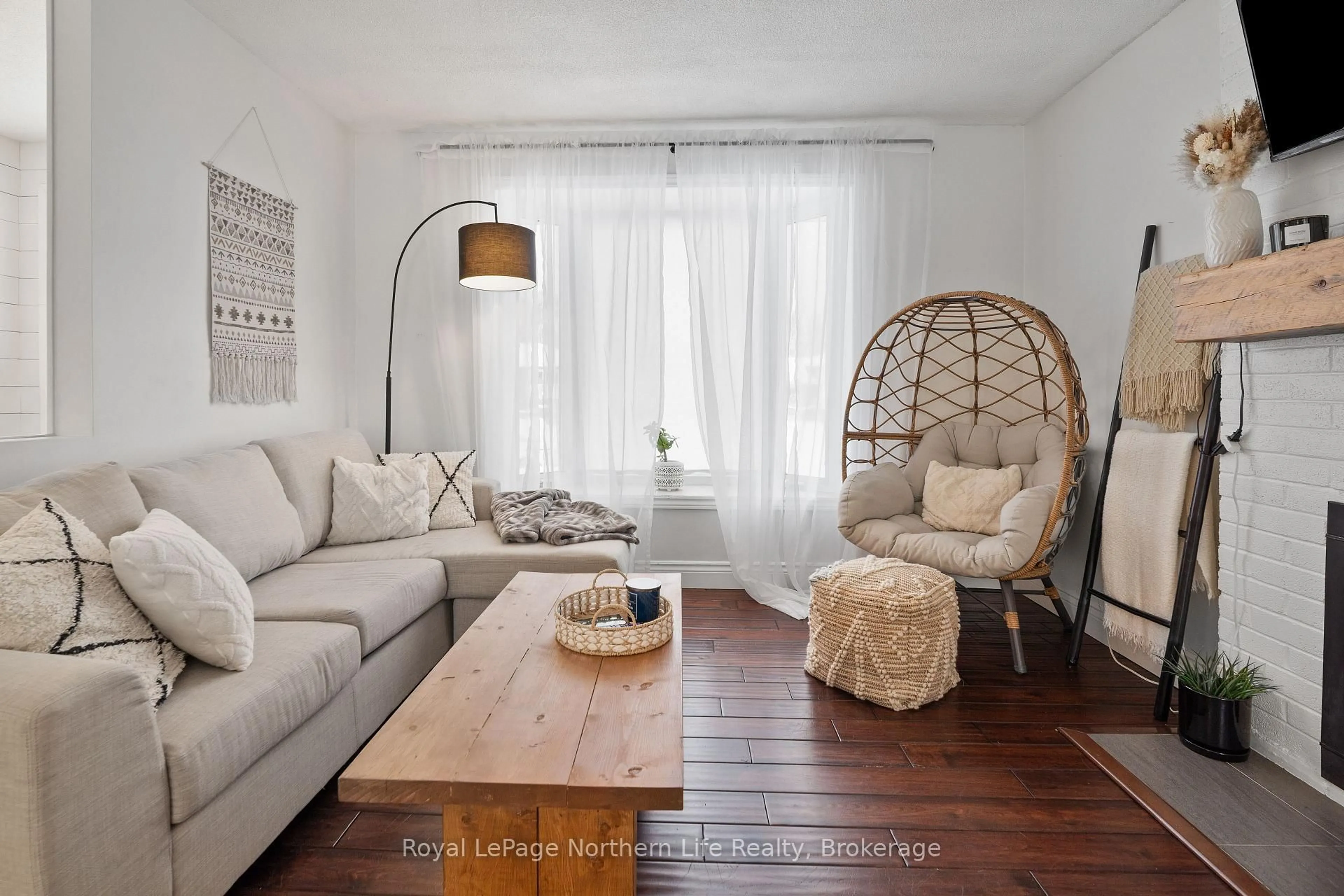 Living room with furniture, wood/laminate floor for 15 Tweedsmuir Dr, North Bay Ontario P1A 2V3