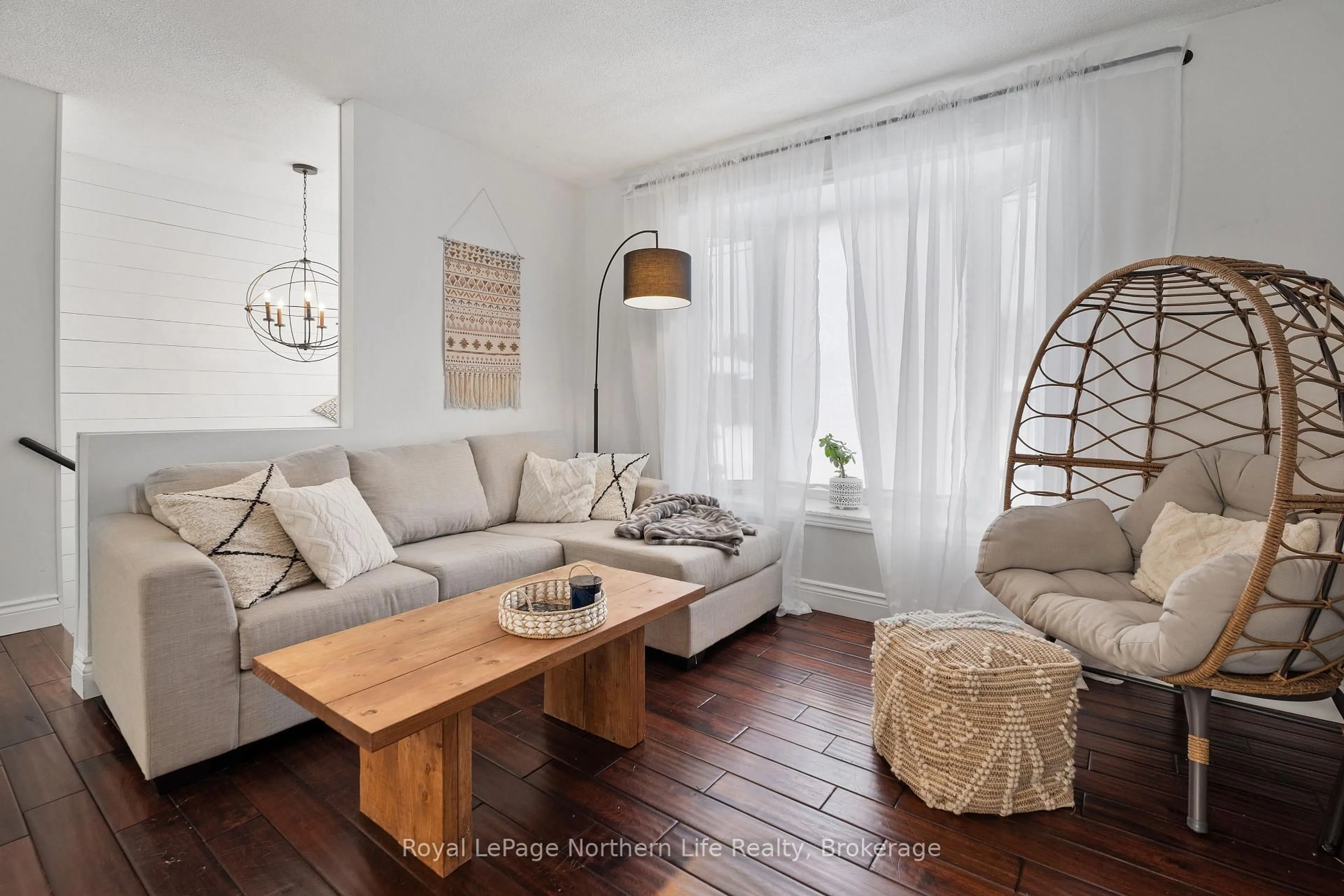 Living room with furniture, wood/laminate floor for 15 Tweedsmuir Dr, North Bay Ontario P1A 2V3