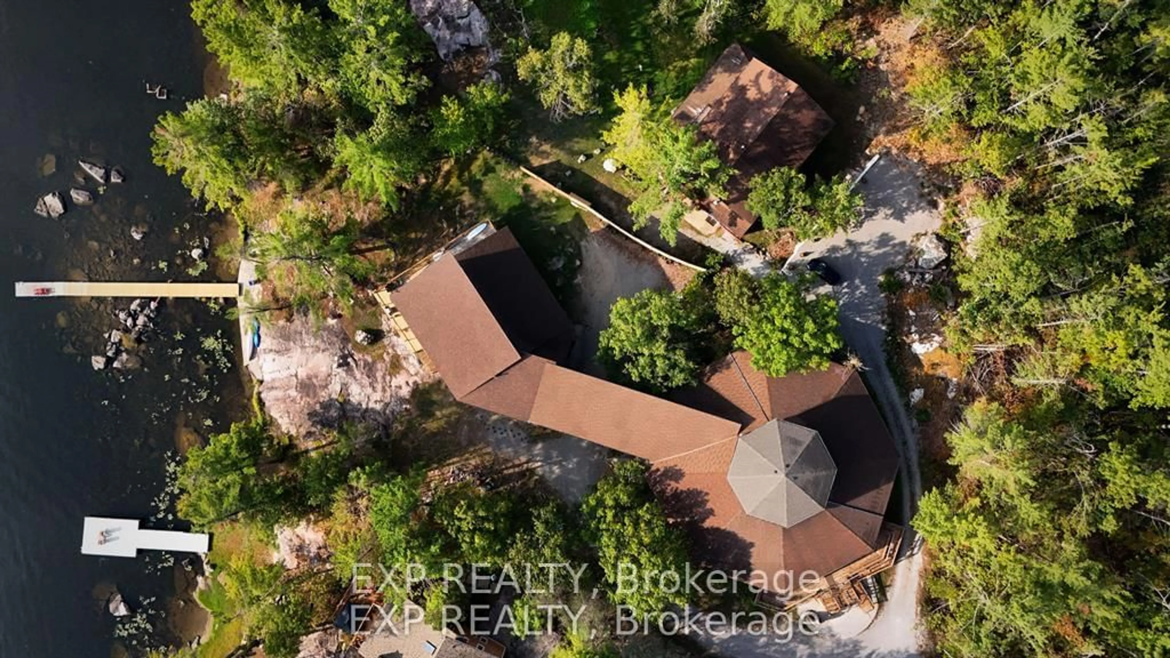 A pic from outside/outdoor area/front of a property/back of a property/a pic from drone, forest/trees view for 65 Fire Rte, Trent Lakes Ontario K0L 1J0