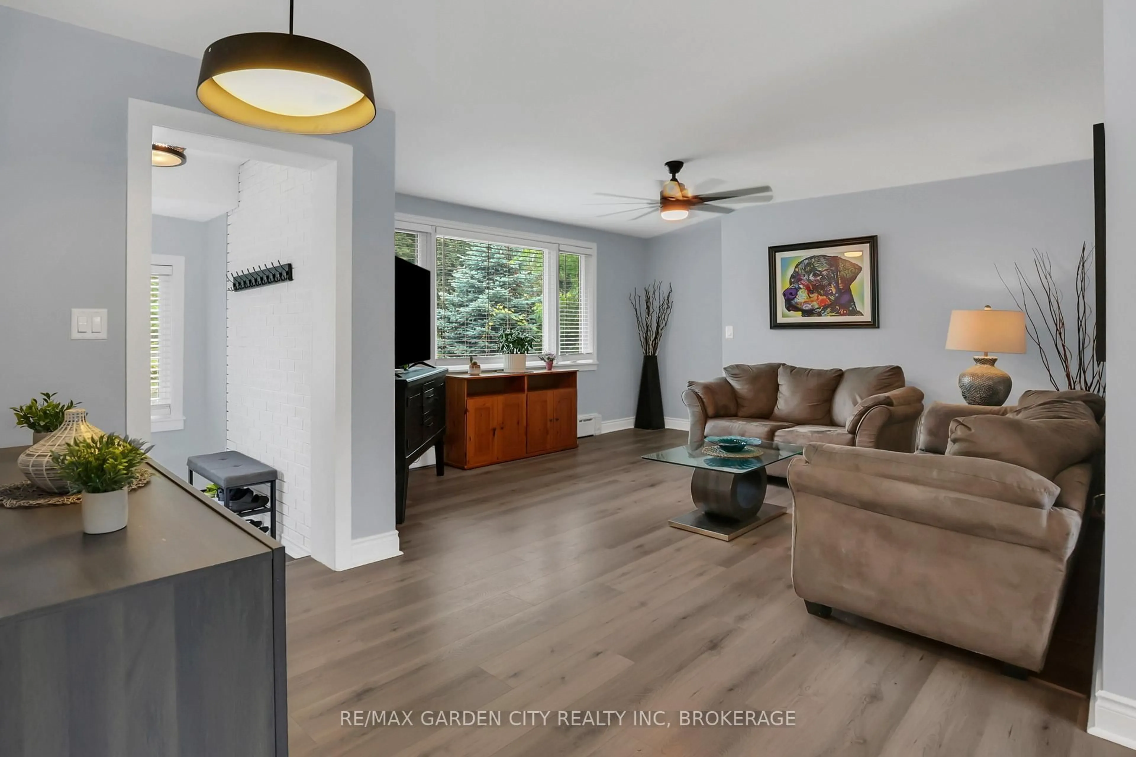 Living room with furniture, wood/laminate floor for 222 Ridgeway Rd, Fort Erie Ontario L0S 1B0