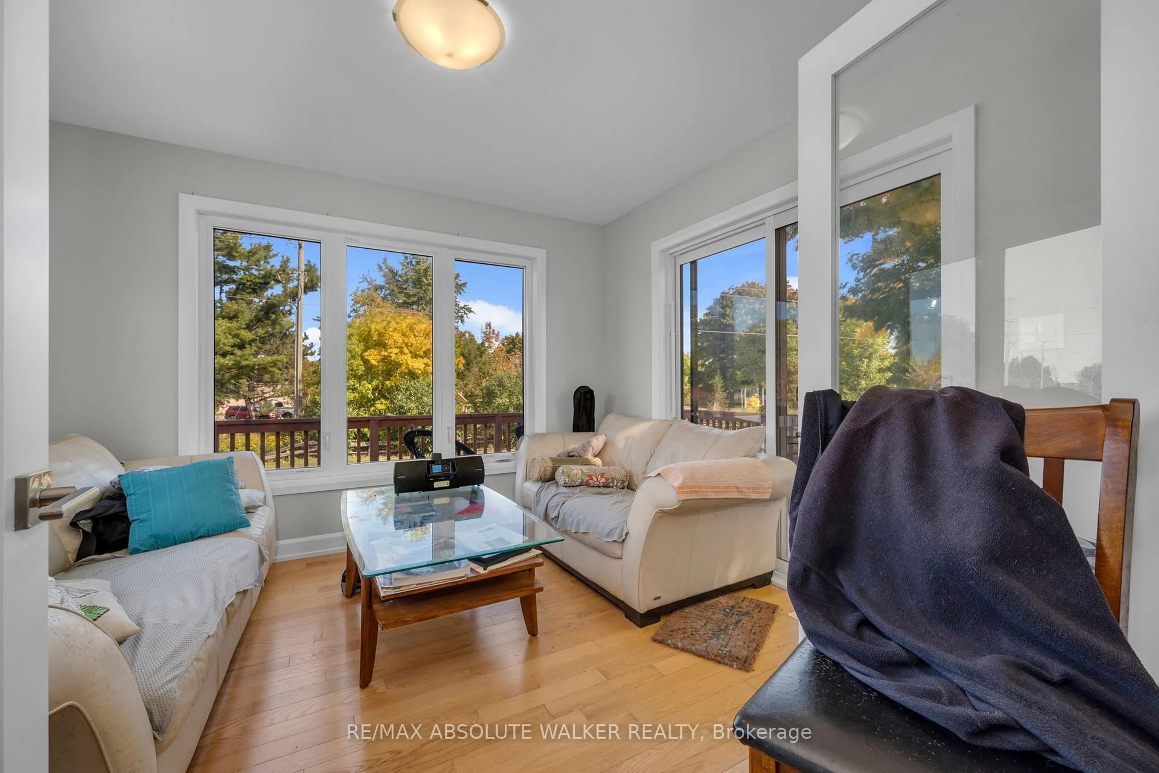 Living room with furniture, wood/laminate floor for 102 Sophie Lane, Merrickville-Wolford Ontario K0G 1N0