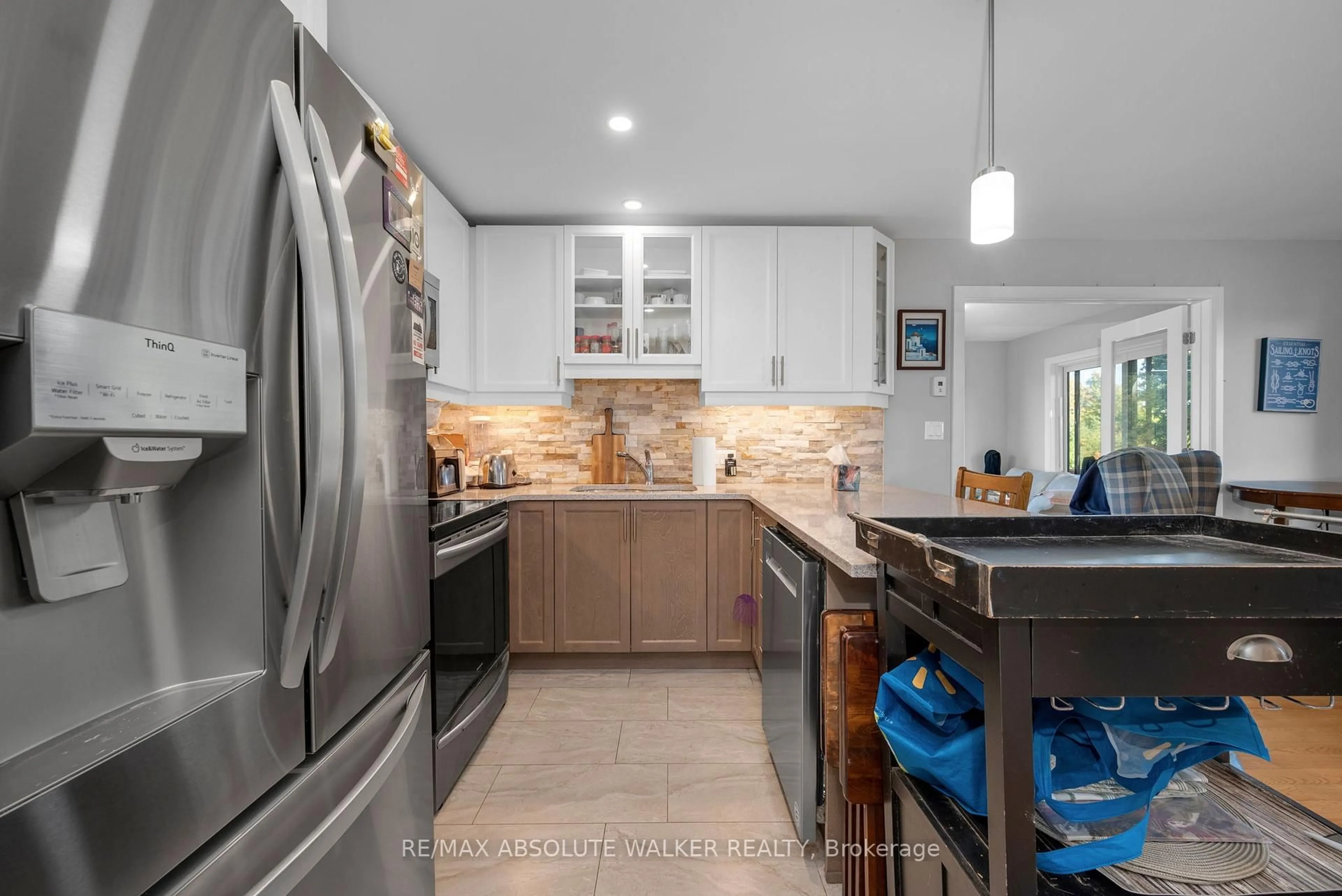 Open concept kitchen, ceramic/tile floor for 102 Sophie Lane, Merrickville-Wolford Ontario K0G 1N0