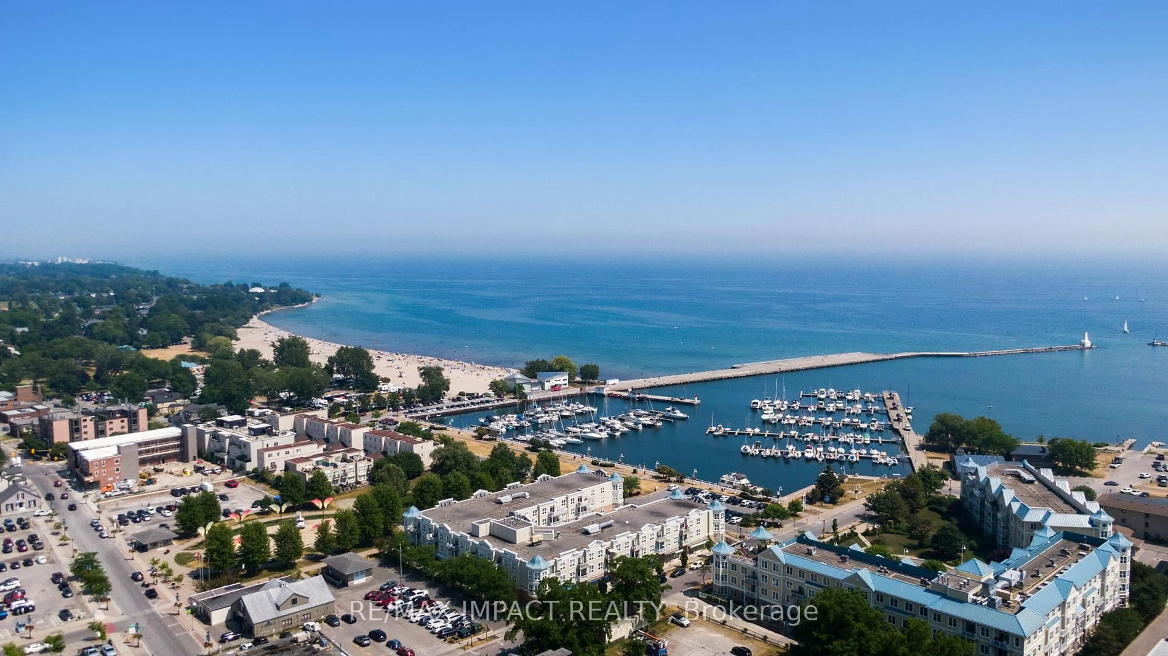 A pic from outside/outdoor area/front of a property/back of a property/a pic from drone, water/lake/river/ocean view for 148 Third St #222, Cobourg Ontario K9A 5X2