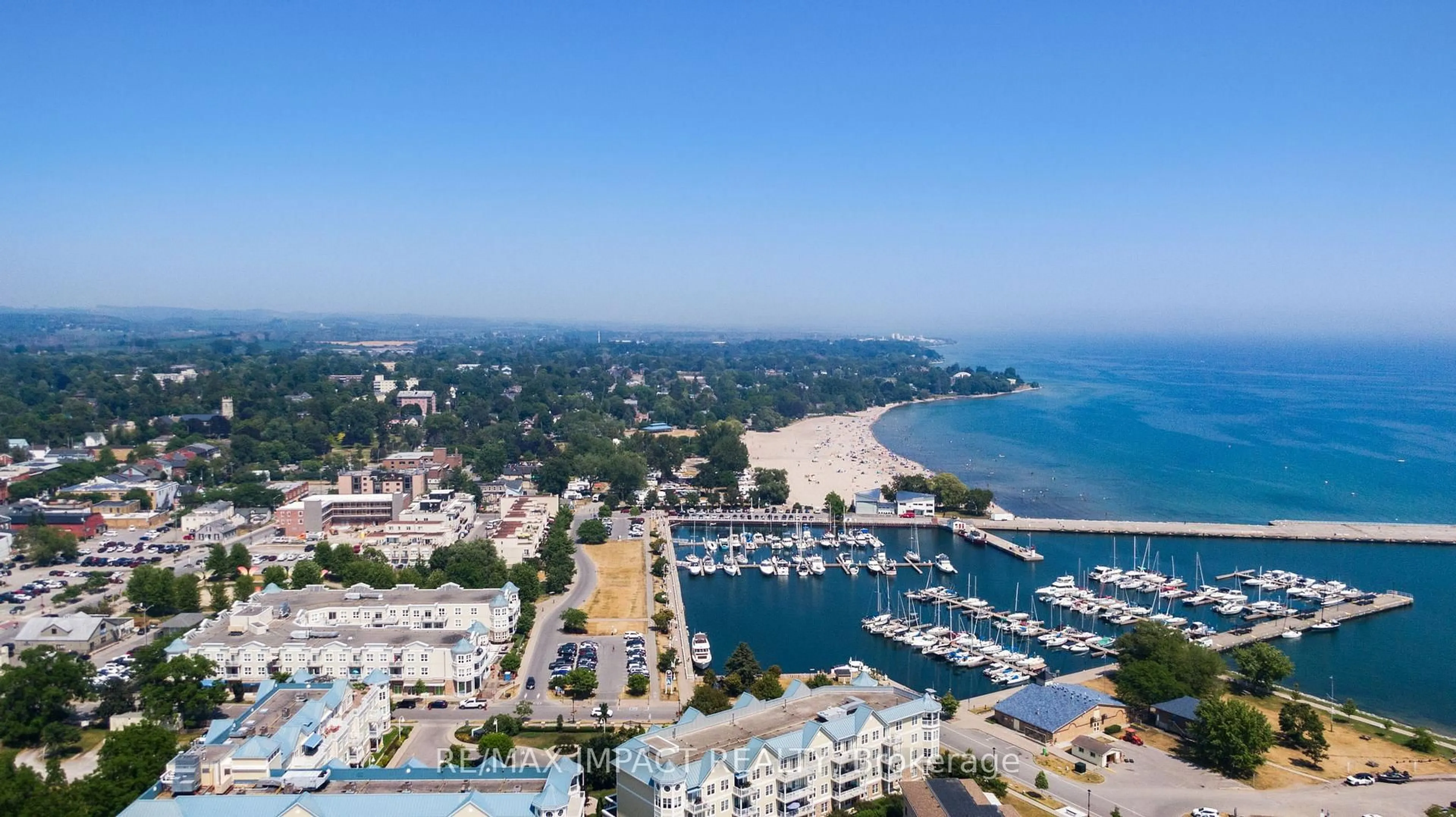 A pic from outside/outdoor area/front of a property/back of a property/a pic from drone, water/lake/river/ocean view for 148 Third St #222, Cobourg Ontario K9A 5X2