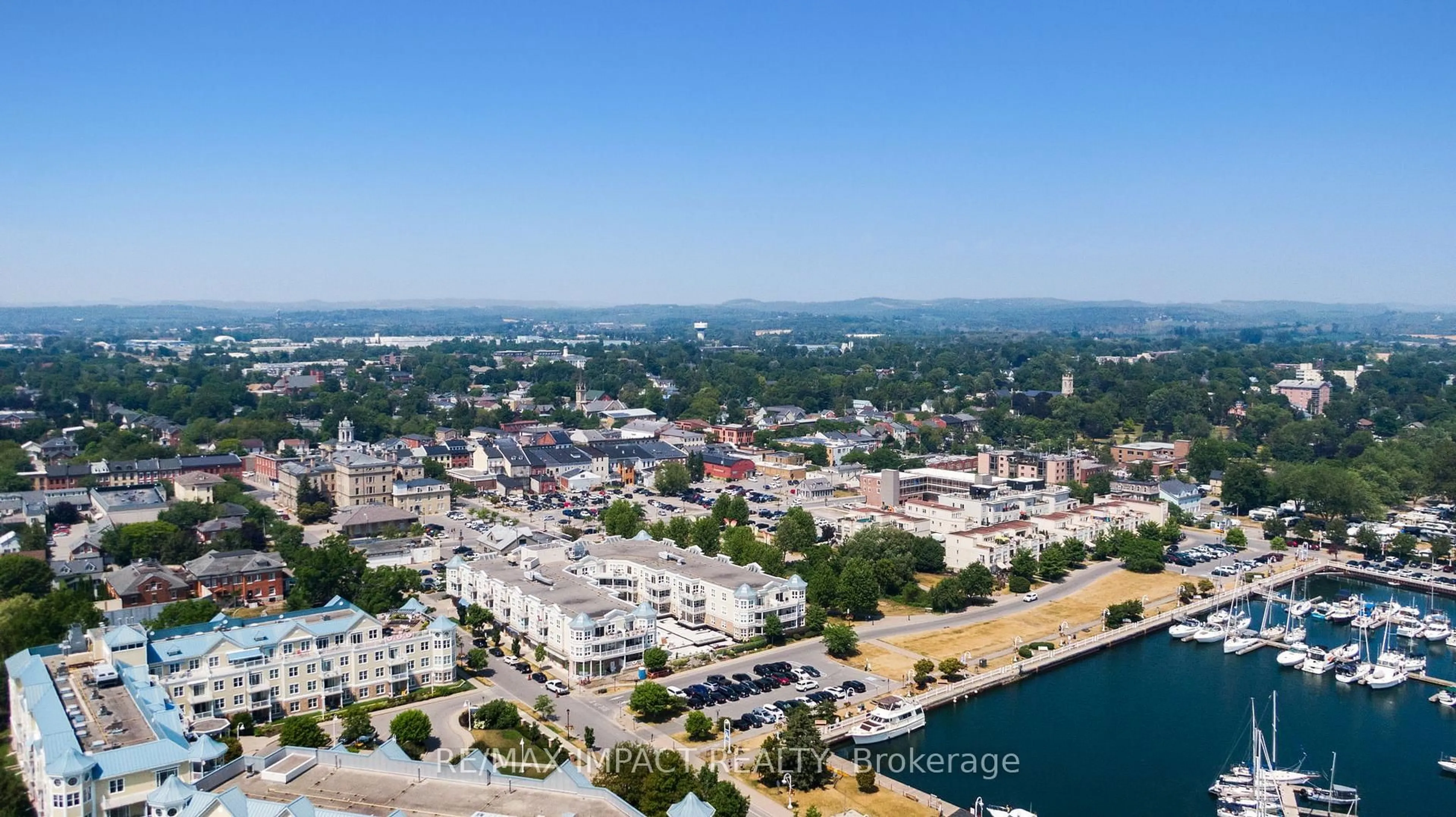 A pic from outside/outdoor area/front of a property/back of a property/a pic from drone, water/lake/river/ocean view for 148 Third St #222, Cobourg Ontario K9A 5X2